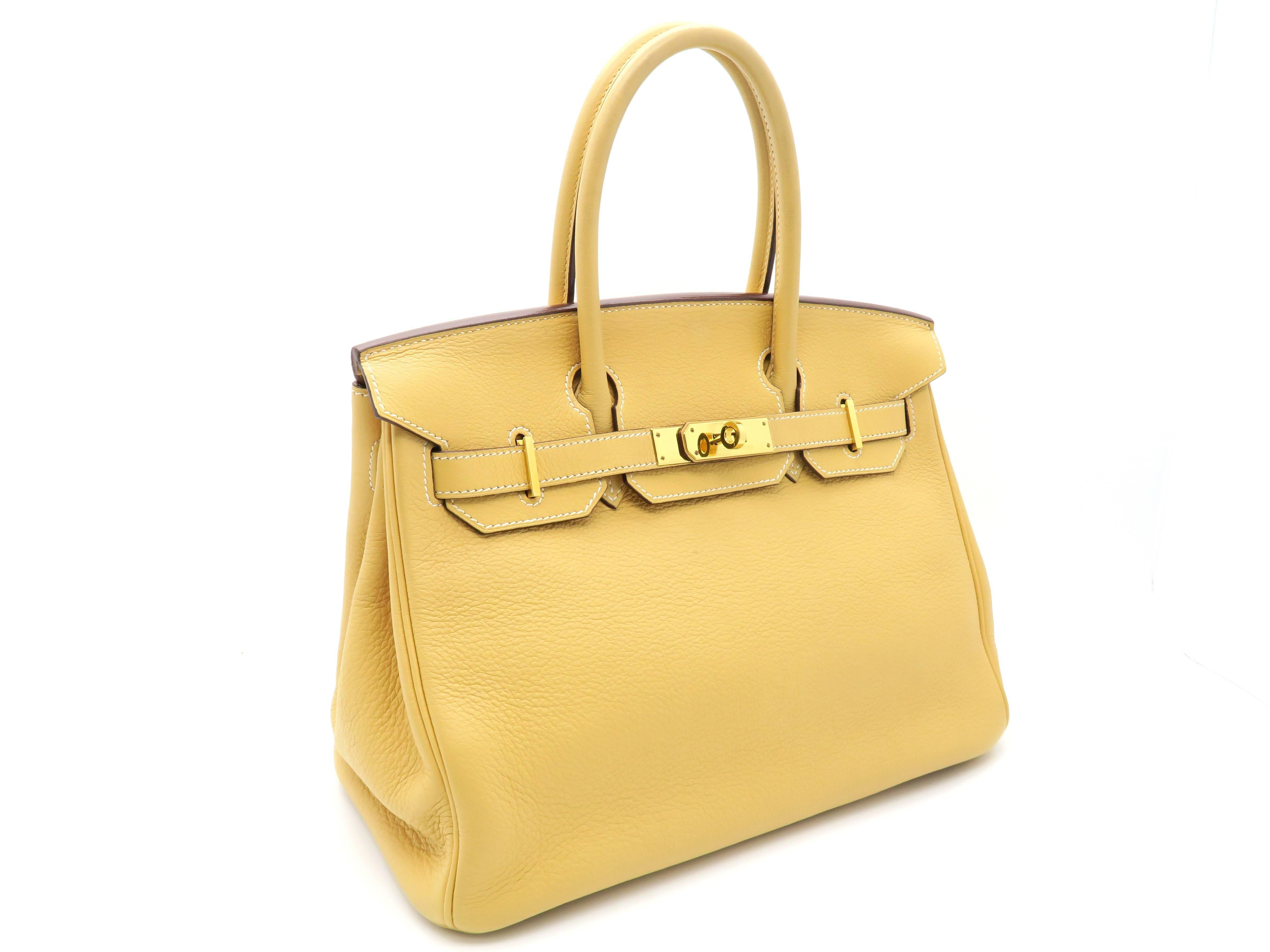 Color: Yellow / Natural Sable (designer color)
Material: Clemence Leather 

Condition:
Rank B
Overall: Fair. Few defects
Surface: Minor Scratches
Corners: Minor Scratches & Stains
Edges: Minor Scratches
Handles/Straps: Minor Scratches