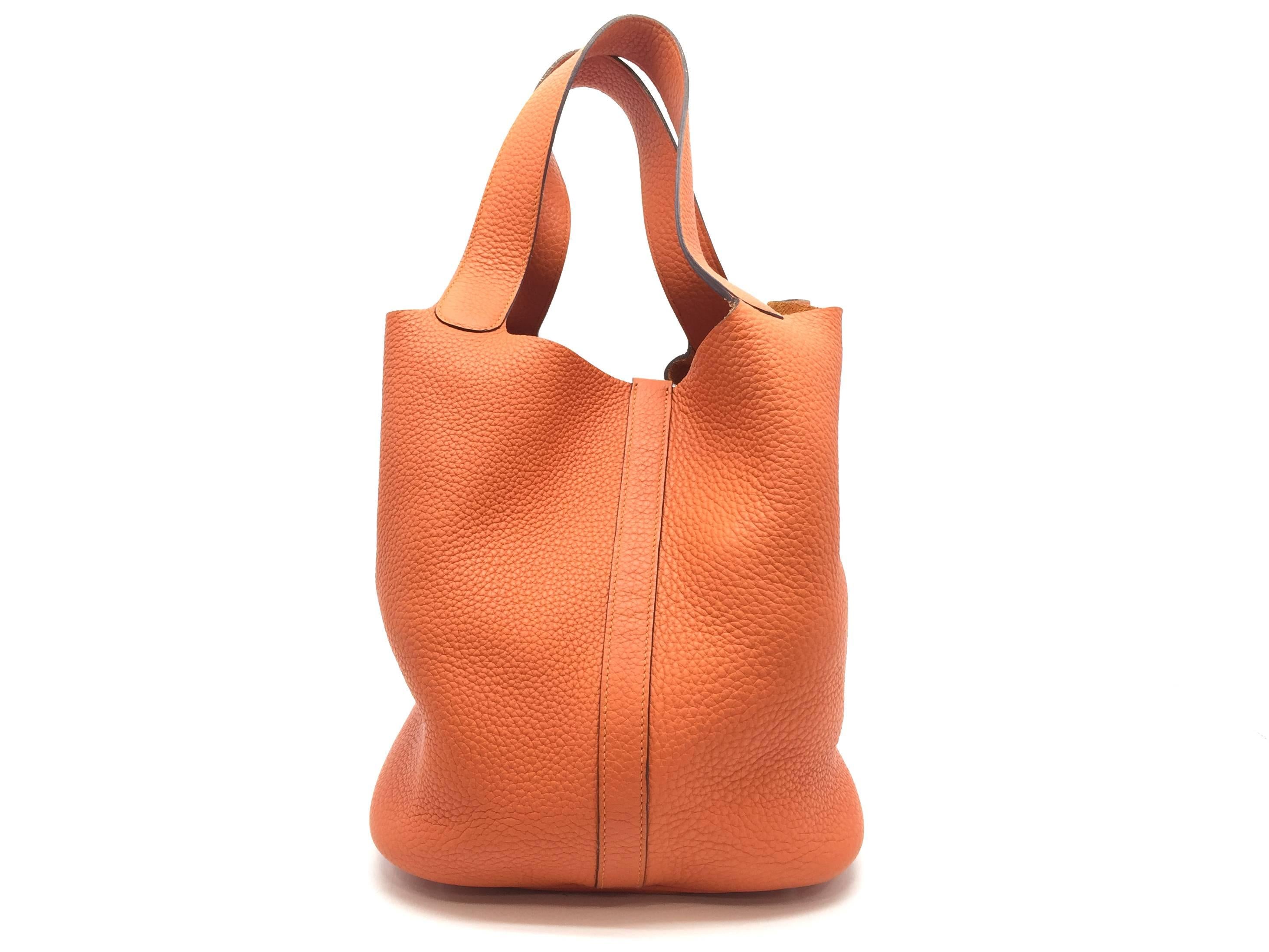 Color: Orange / Feu (designer color)
Material: Clemence Leather

Condition:
Rank A
Overall: Good, few minor defects
Surface: Good
Corners: Good
Edges: Minor Scratches
Handles/Straps: Minor Scratches
Hardware: Minor Scratches &