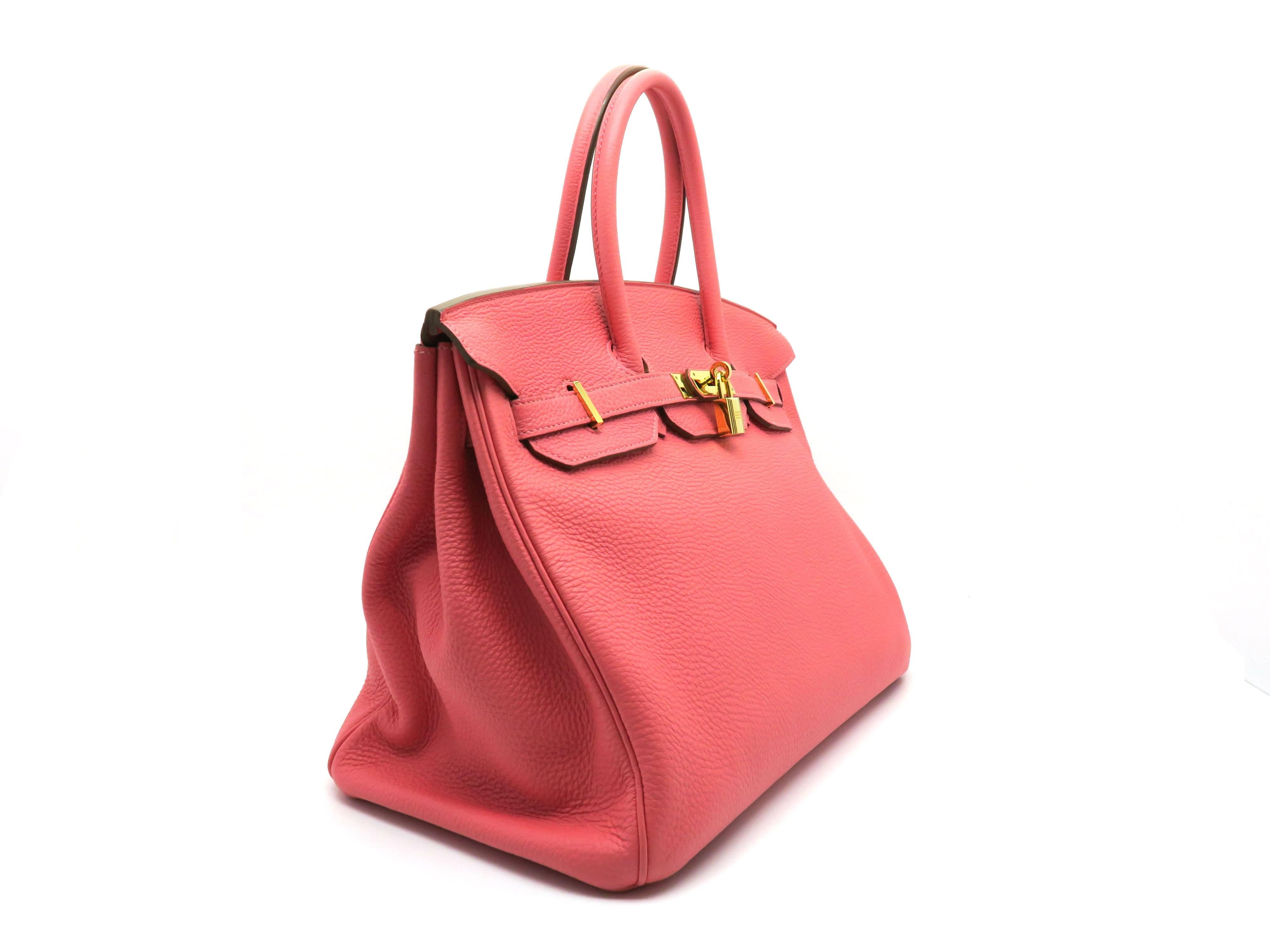 Color: Coral / Rouge Pivoinve (designer color) 

Material: Togo Leather 

Condition: Rank A 
Overall: Good, few minor defects. 
Surface: Good 
Corners: Minor Scratches & Stains
Edges: Good
Handles/Straps: Good 
Hardware: Minor