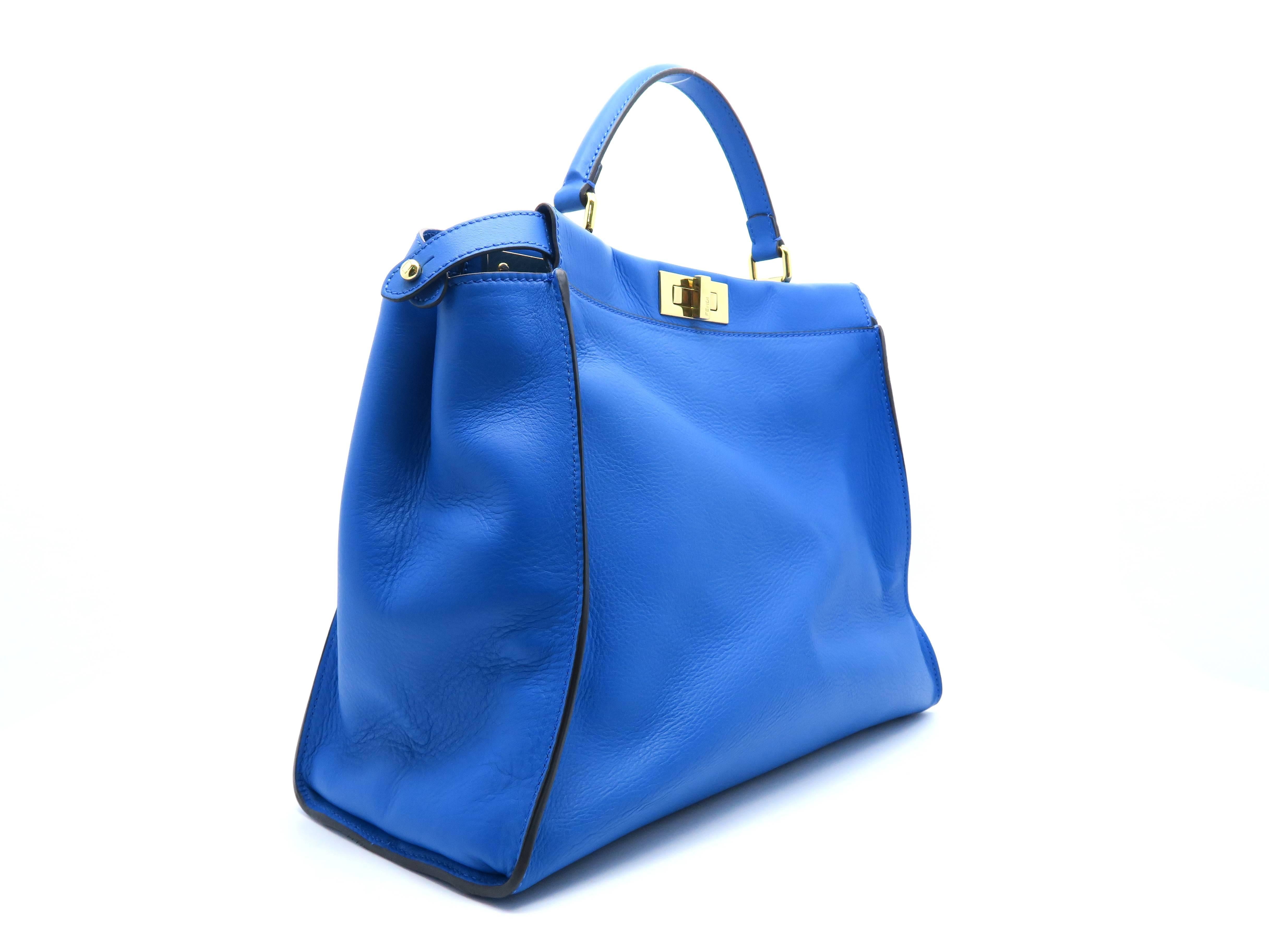 Color: Blue 

Material: Calfskin Leather 

Condition: Rank A 
Overall: Good, few minor defects. 
Surface: Good
Corners: Minor Scratches
Edges: Good
Handles/Straps: Minor Scratches
Hardware: Minor Scratches

Dimension: W40 × H31 ×