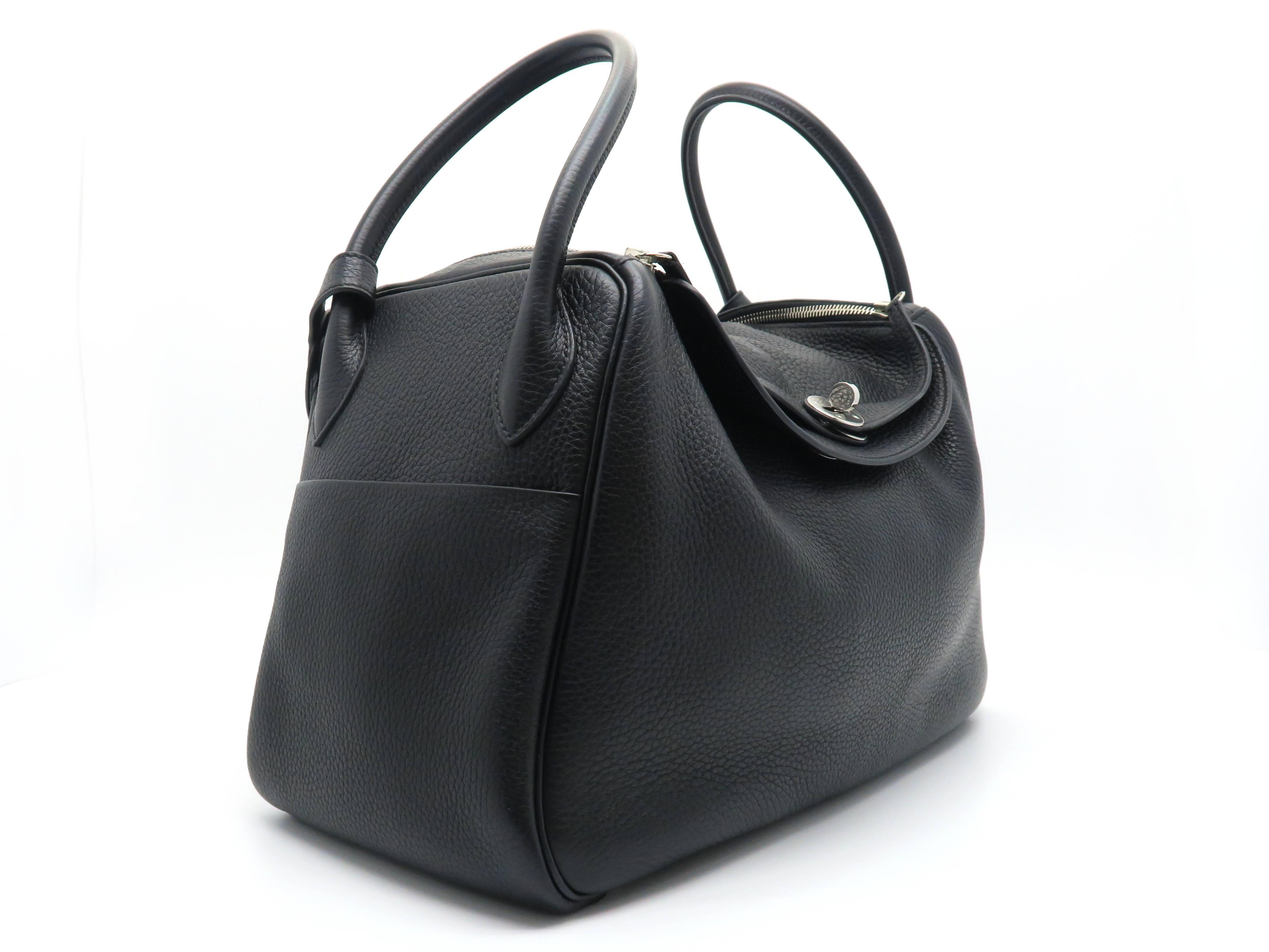 Color: Noir (designer color) / Black

Material: Taurillon Clemence Leather

Condition: Rank A
Overall: Good, few minor defects
Surface: Good
Corners: Good
Edges: Good
Handles/Strap: Good
Hardware: Minor Scratches
Others: Leather Slightly