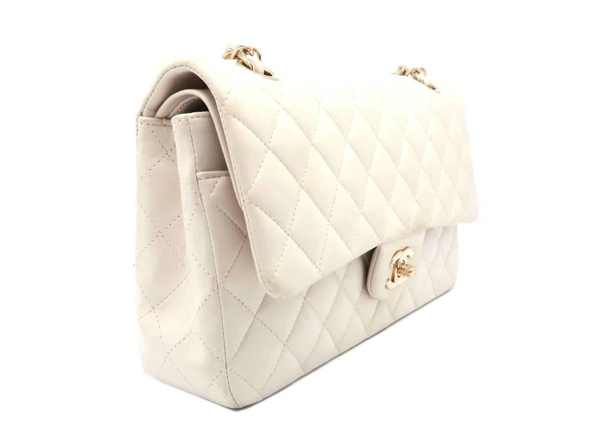 Color: White 

Material: Quilted Lambskin Leather

Condition: Rank B 
Overall: Fair. Few defects
Surface: Obvious Scratches & Stains
Corners: Obvious Scratches & Stains
Edges: Good
Handles/Straps: Minor Stains
Hardware: Minor