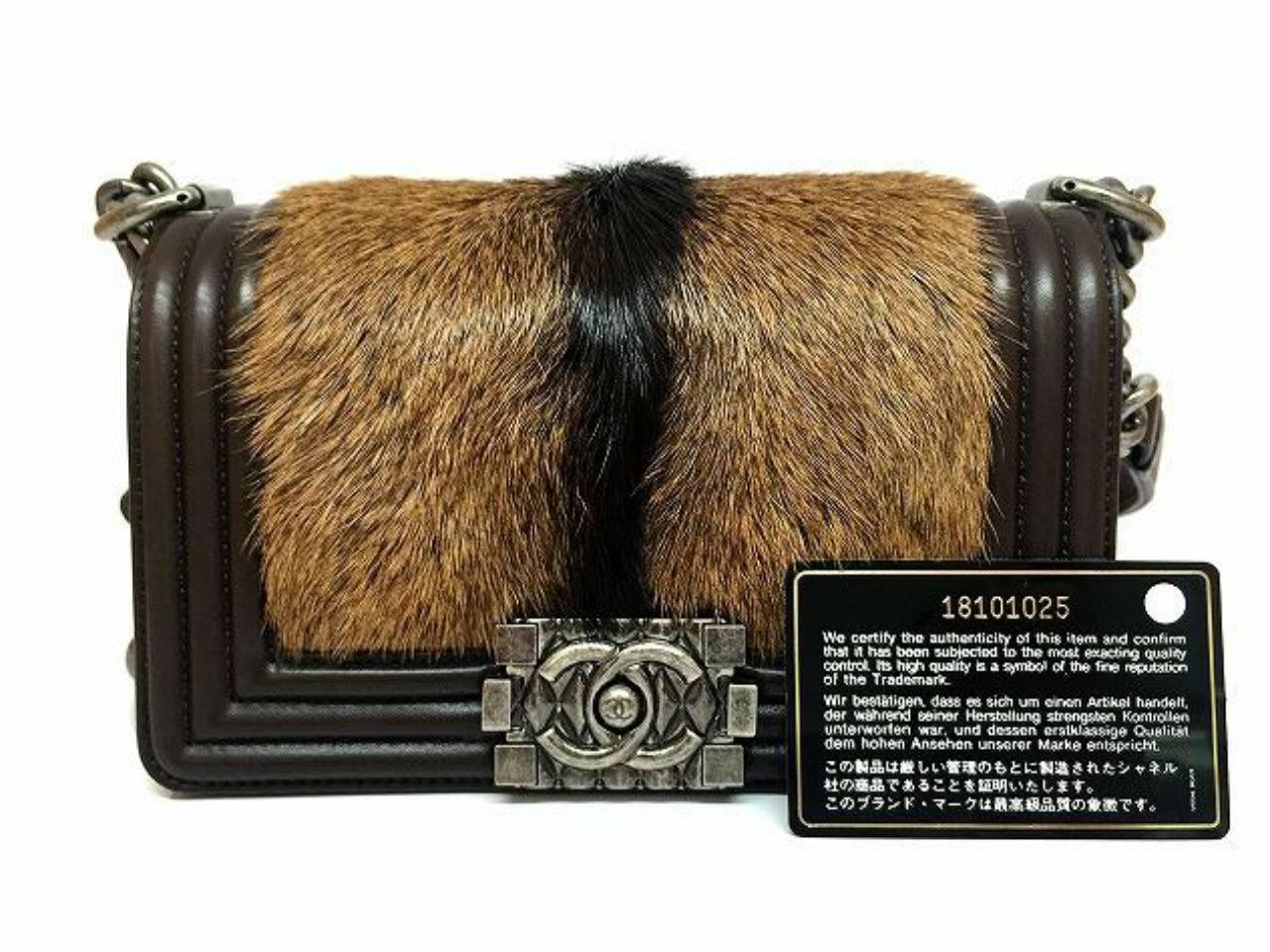 Color: Brown 

Material: Pony hair calfskin leather

Condition: Rank N 
Overall: Brand New, not used
Surface: Good
Corners: Good
Edges: Good
Handles/Straps: Good
Hardware: Good

Dimension: W20 × H12 × D8cm（W7.8" × H4.7" ×