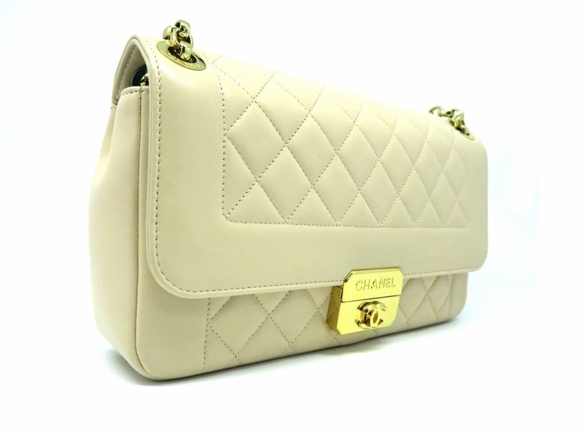 Color: Beige 

Material: Quilted Calfskin Leather 

Condition: Rank A 
Overall: Good, few minor defects
Surface: Minor Scratches
Corners: Minor Scratches
Edges: Minor Scratches
Handles/Straps: Minor Scratches
Hardware: Minor Scratches

Dimension: