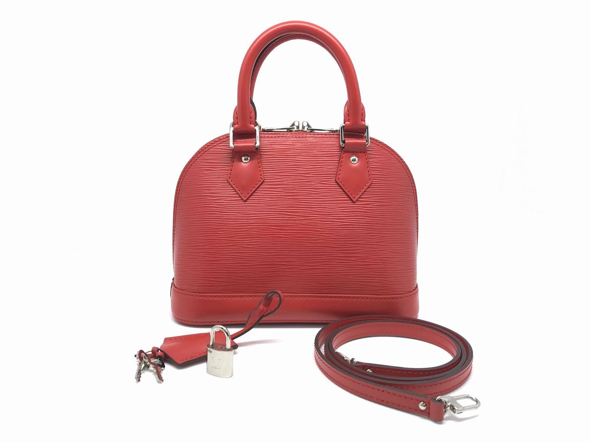 Color: Red 

Material: Epi Leather 

Condition: Rank A 
Overall: Good, few minor defects
Surface: Good
Corners: Minor Scratches
Edges: Good
Handles/Straps: Good
Hardware: Minor Scratches

Dimension: W23 × H18 × D11cm（W9.0" × H7.0" ×