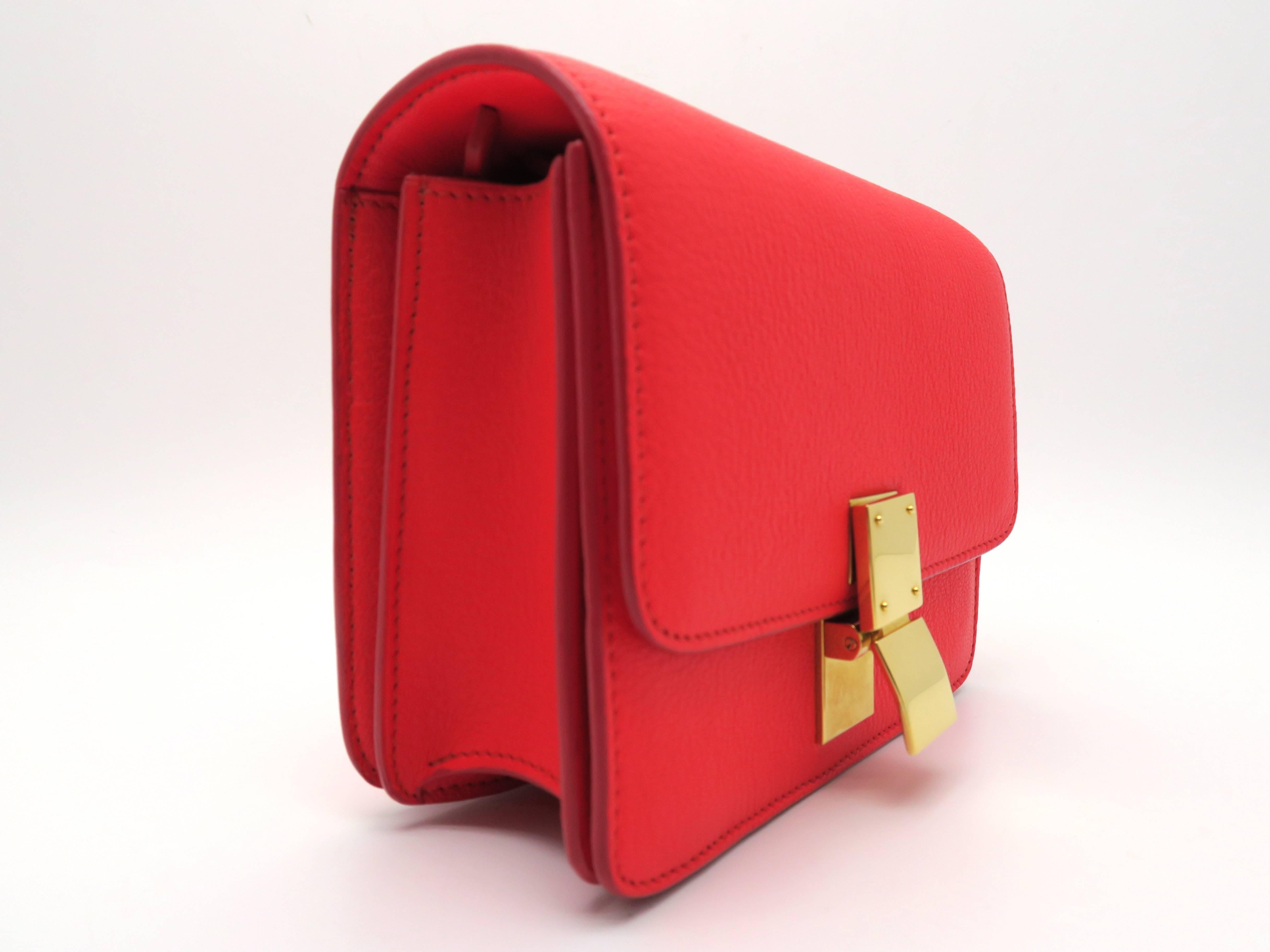 Color: Red

Material: Calfskin Leather

Condition: Rank A
Overall: Good, few minor defects
Surface: Minor Stains
Corners : Good
Edges: Good 
Handles/Straps: Good 
Hardware: Minor Scratches

Dimension: W16.5 × H13.5 × D6cm（W6.4" × H5.3" ×