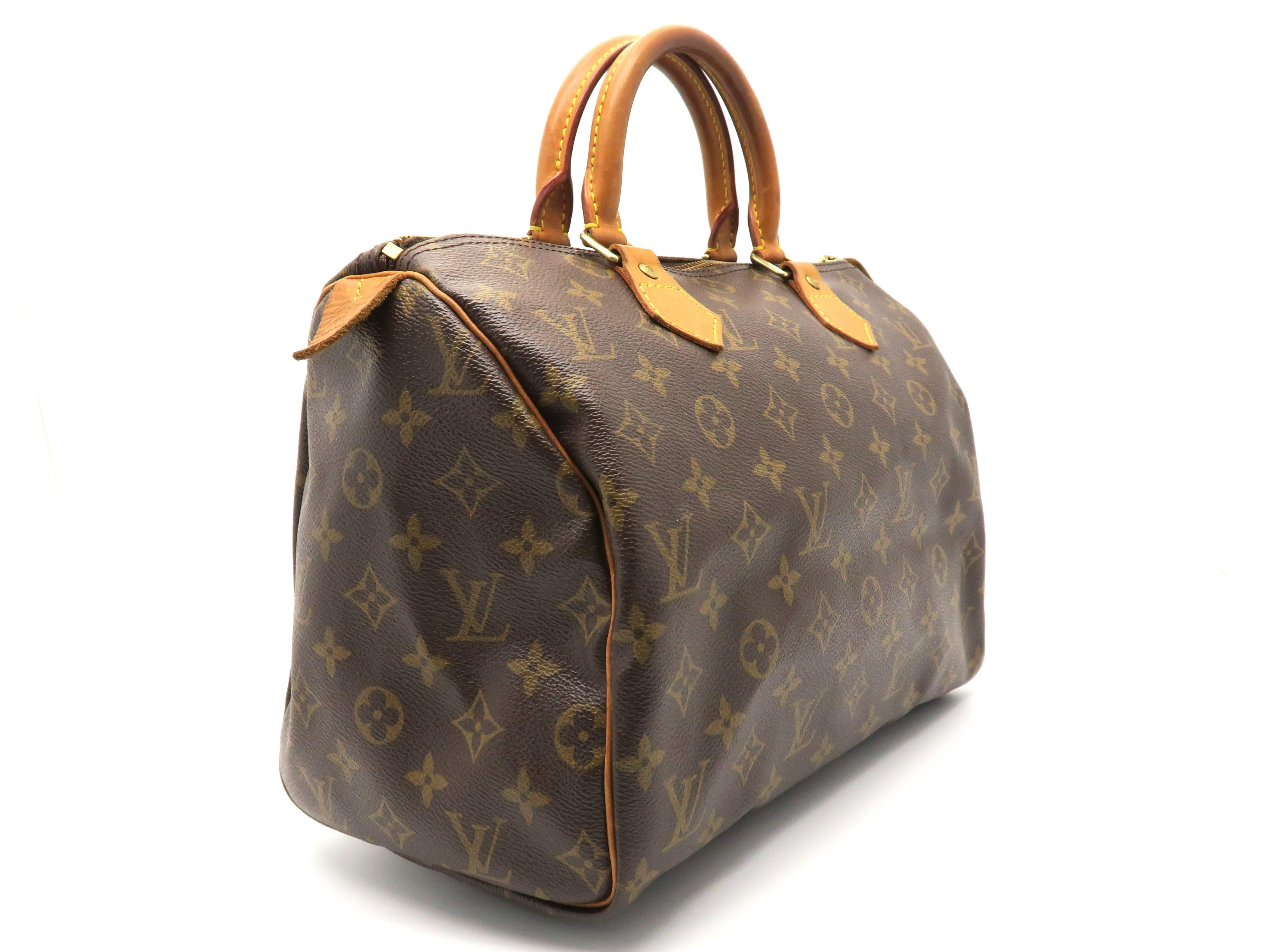 Color: Brown 

Material: Monogram Canvas

Condition: Rank B
Overall: Fair. Few defects 
Surface: Minor Scratches
Corners: Obvious Scratches
Edges: Obvious Scratches
Handles/Straps: Minor Scratches
Hardware: Minor Scratches

Dimension: W30 × H20 ×