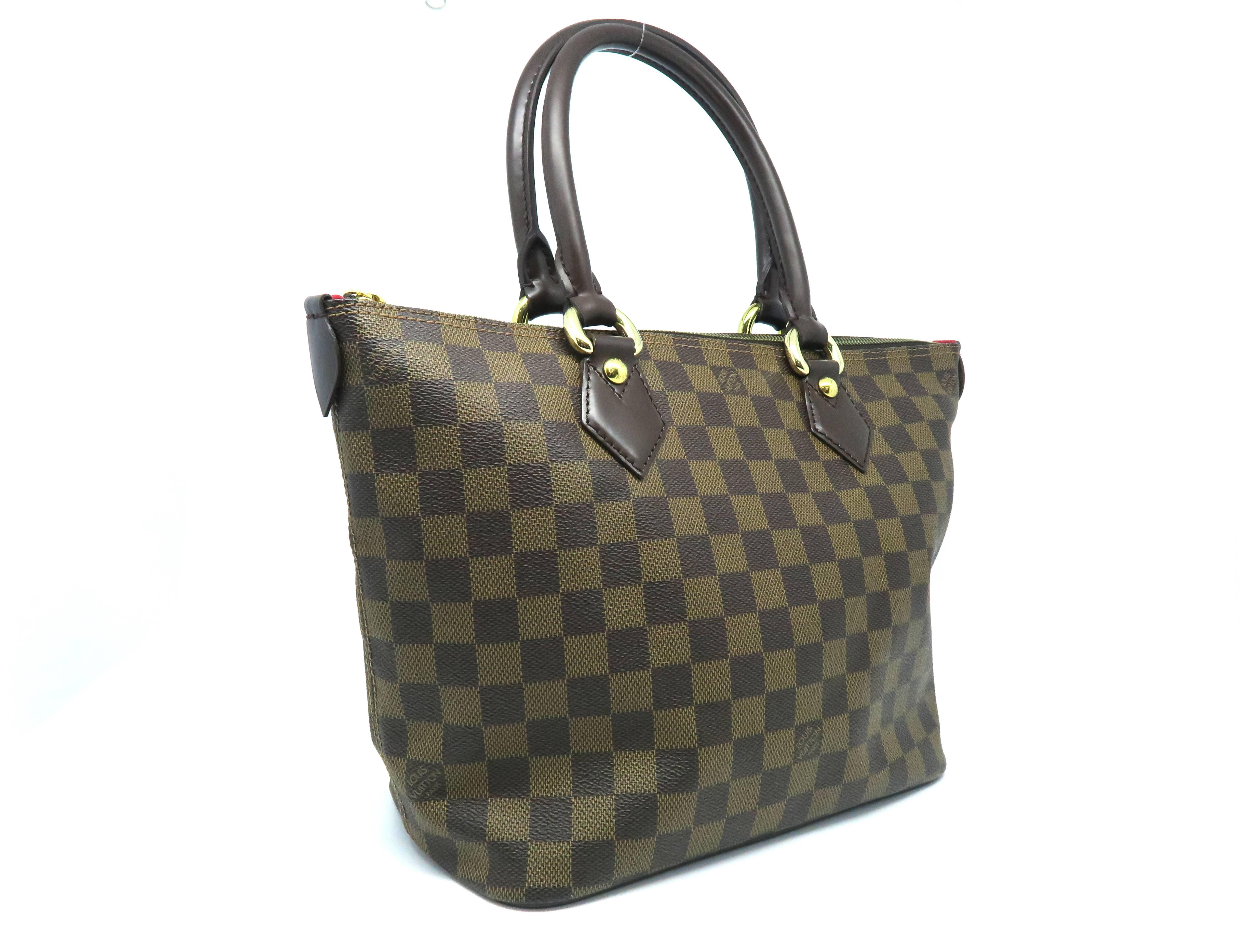 Color: Brown 

Material: Damier

Condition: Rank A 
Overall: Good, few minor defects
Surface: Minor Scratches
Corners: Minor Scratches
Edges: Good
Handles/Straps: Good
Hardware: Minor Scratches
Inside: Minor Stains

Dimension: W26 × H23 ×