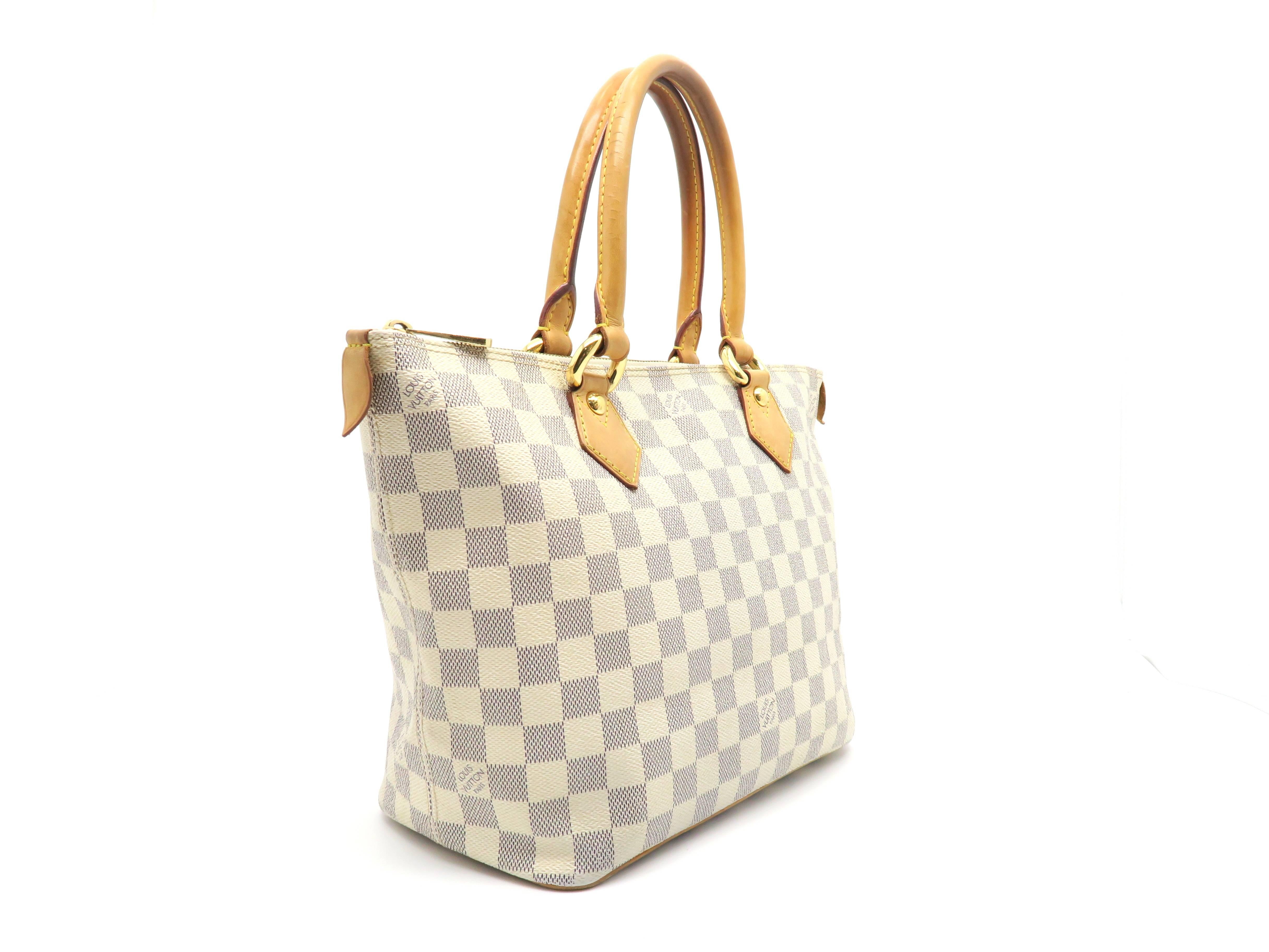 Color: White

Material: Damier Azur

Condition: Rank A
Overall: Good, few minor defects
Surface: Minor Scratches
Corners: Minor Scratches
Edges: Minor Scratches
Handles/Straps: Minor Scratches 
Hardware: Minor Scratches

Dimension: W26 × H23 ×
