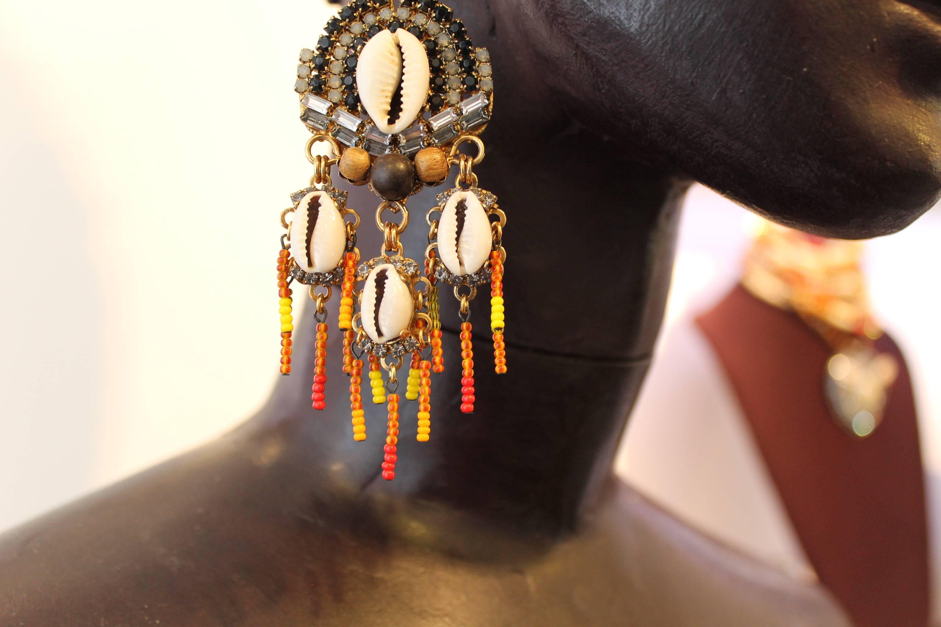 Incredible, one-of-a-kind huge statement earrings. A wildly contrasting blend of Vicki’s imagination, featuring red, black and grey Swarovski crystals, fire-coloured seed beads, shells and wooden beads. 
Holiday perfection, from The Earring Expert,