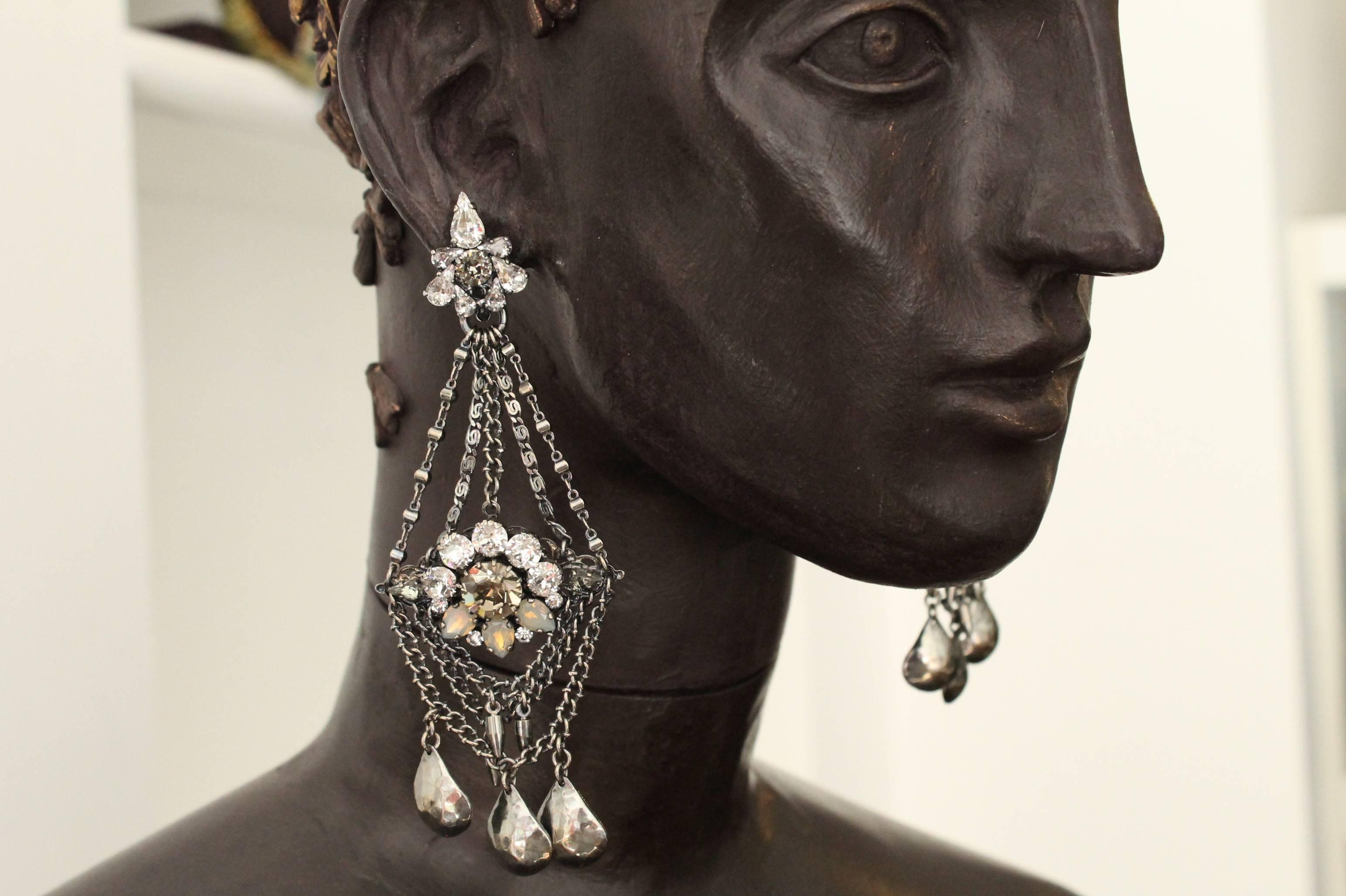 Elegant statement antique silver-plated earrings featuring gorgeous, sparkling Swarovski crystals in a beautiful neutral palette. 

Handmade for the past 25 years by Vicki’s small team of artisans, in the brand’s Belgravia studios which lie beneath
