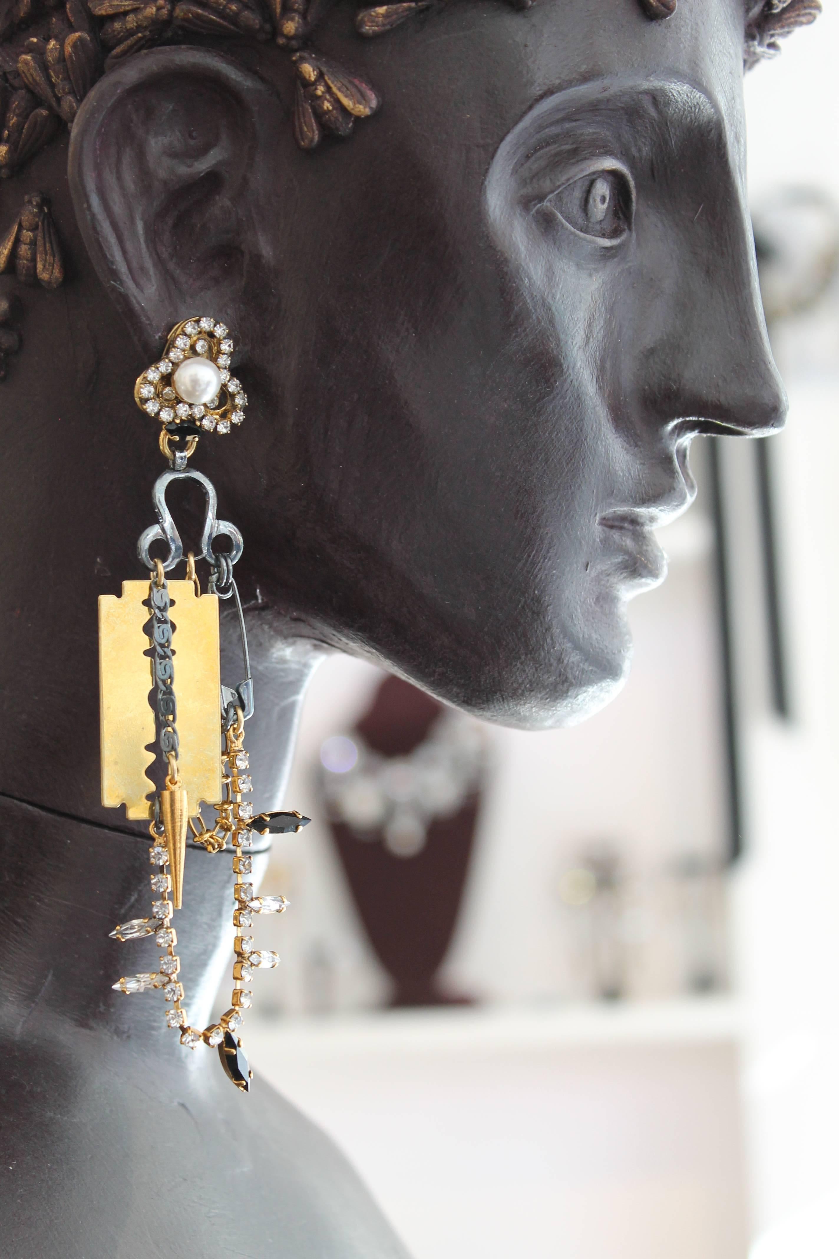 With 23ct gold plated razorblades (blunt) and safety pins, spikes, Swarovski crystal and faux pearl accents - these earrings are made for those who enjoy making a glamorous and original statement. 

VICKISARGE's Punk story encapsulates both the