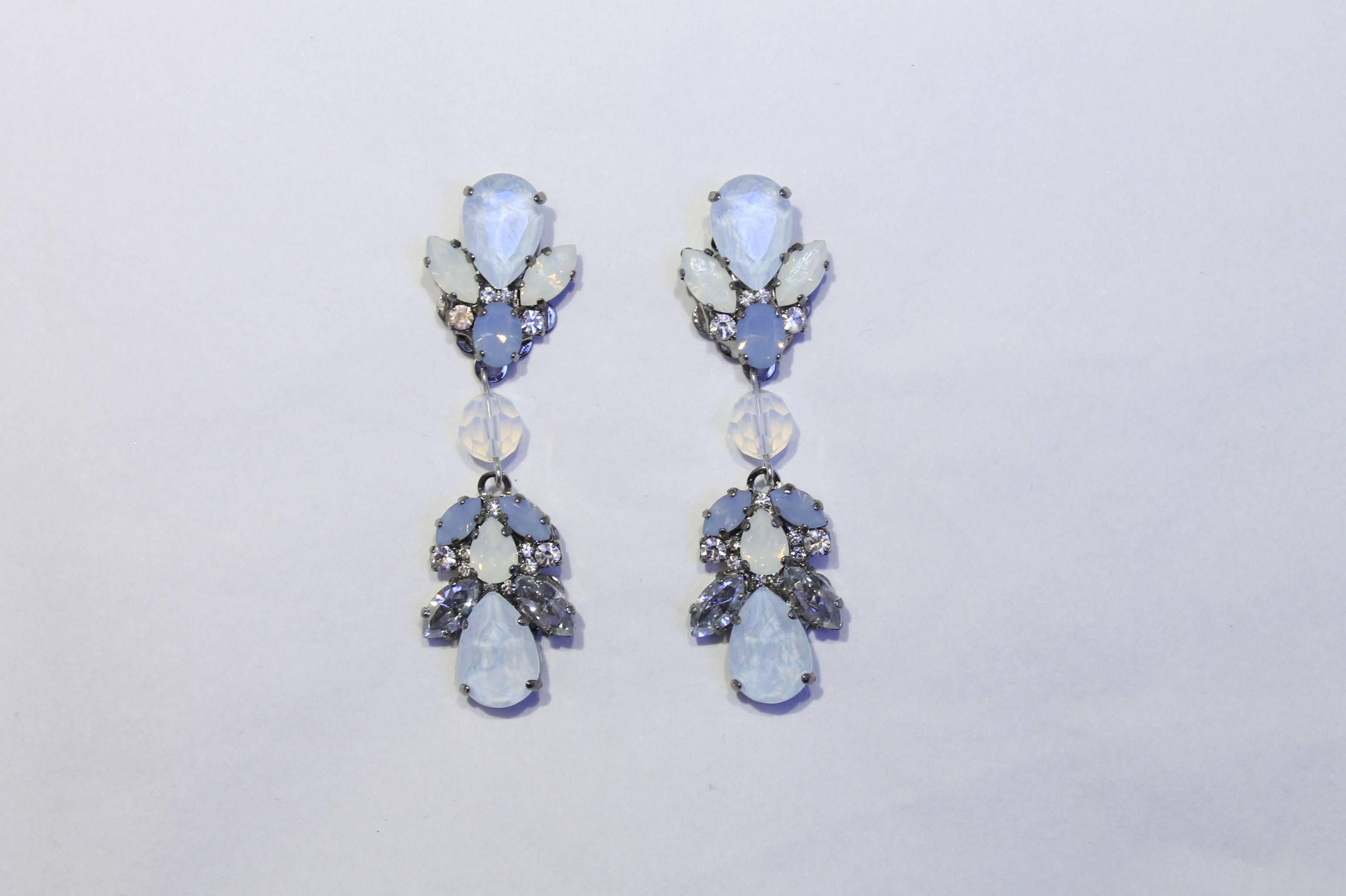 Perfect for summer, these statement drop earrings feature a stunning blend of palest blues, white and opalescent Swarovski crystals.  

Handmade for the past 25 years by Vicki’s small team of artisans, in the brand’s Belgravia studios which lie