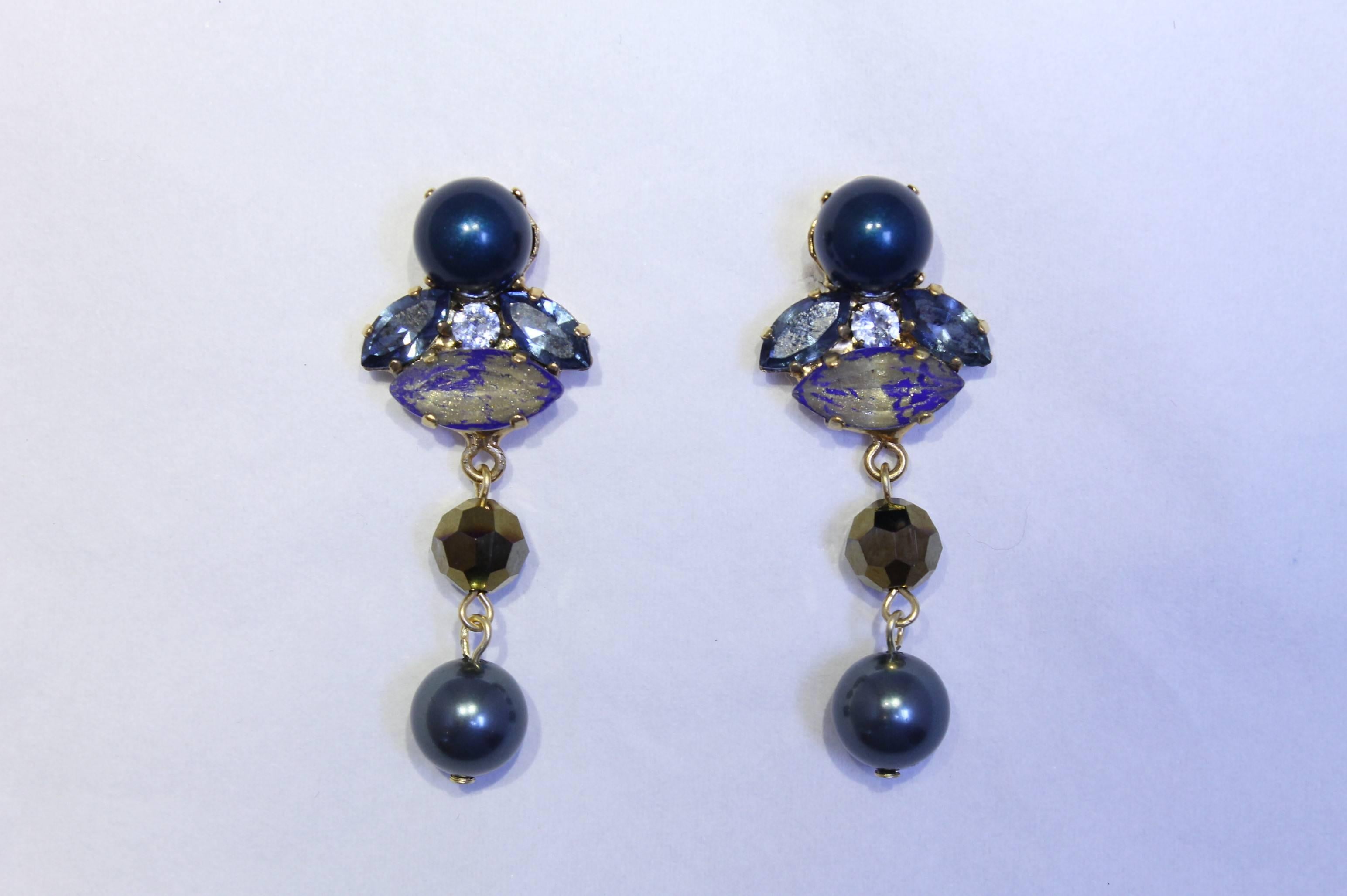 Gorgeous blue and gold hand-enamelled Swarovski crystal and pearl earrings, making each one utterly unique. No two are the same

Refined colour palette from the Earring Expert, VICKISARGE

Handmade for the past 25 years by Vicki’s small team of