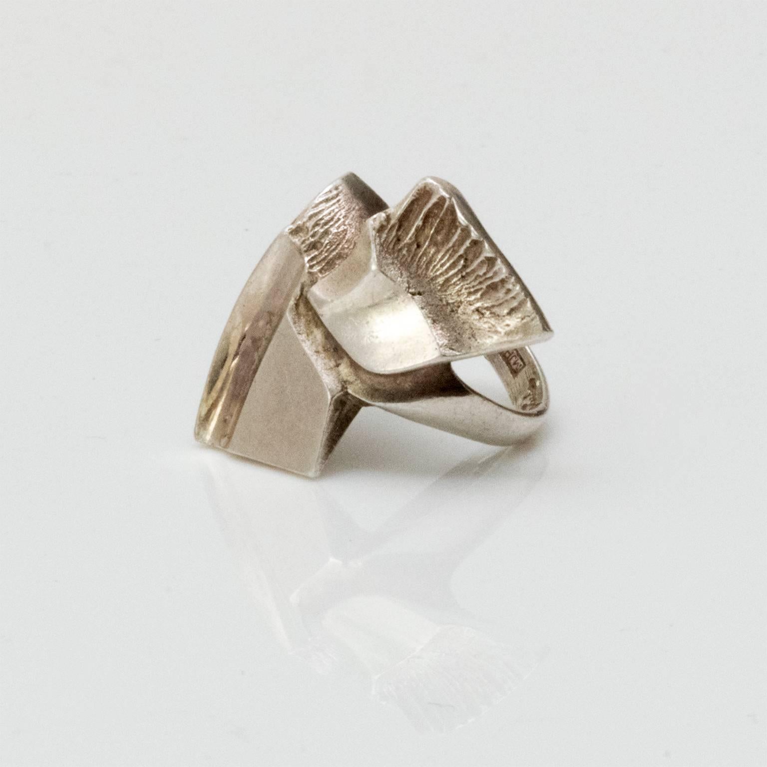 Scandinavian Modern silver ring with acid treated surface with an organic form. Designed by Matti J. Hyvarinen, 1970's, Finland
Diameter: .75