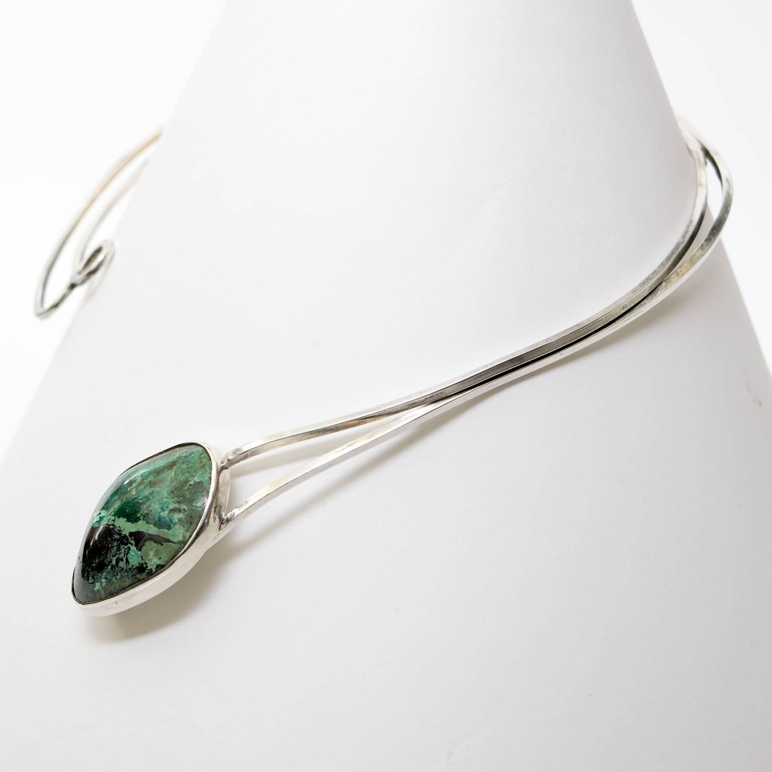 silver necklace with green stone