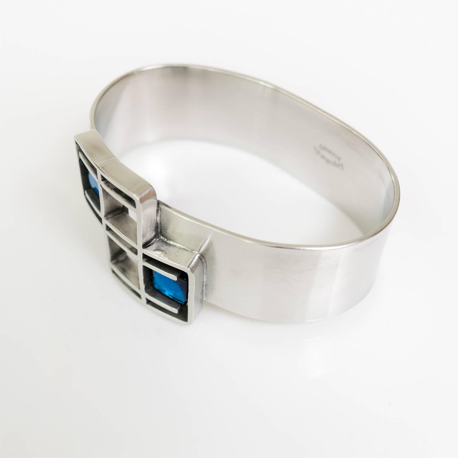 Scandinavian Modern Lögeskov Tenn, polished pewter bracelet with blue glass.  1