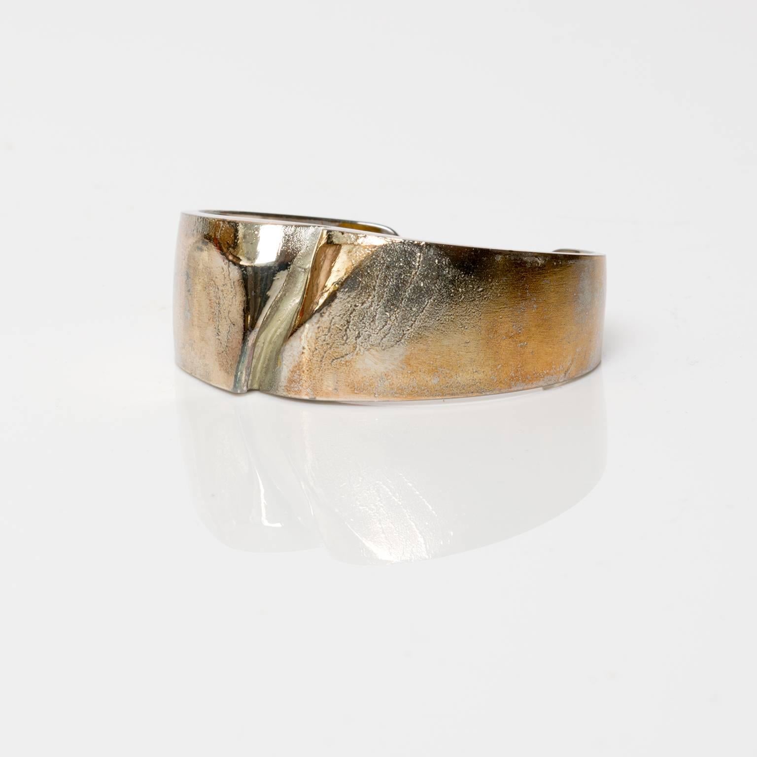 A Finnish silver bracelet in silver by Bjorn Weckstrom for Lapponia, 1971. Weckstrom's work is famous for his unique patination  treatments and surface textures.
 
Width: 2.5