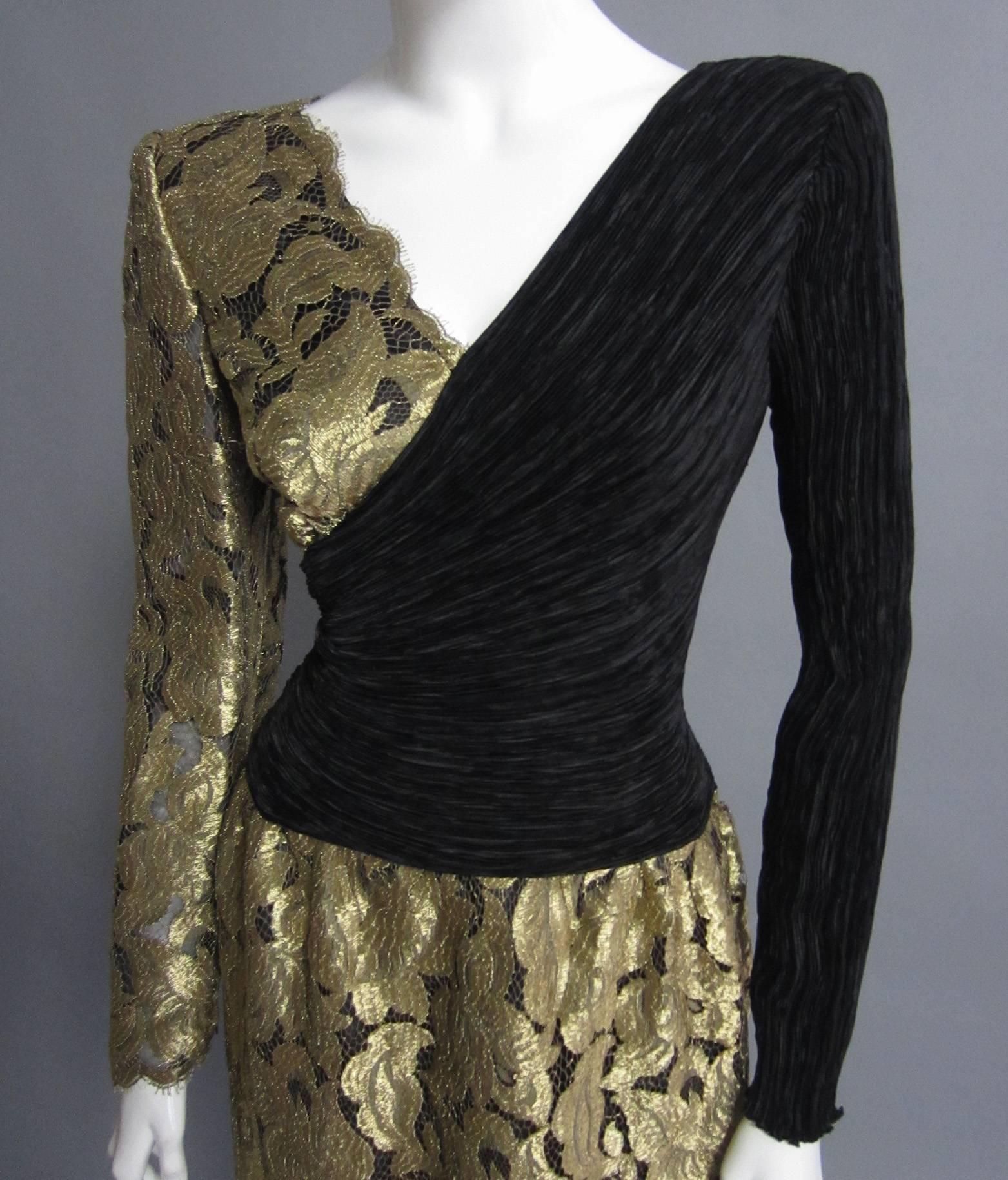 A gorgeous dress from designer MARY MCFADDEN, this dress is predominantly made of gold, ornate lace. The fuller skirt is lined with a dark layer of stiff chiffon and organza; this provides coverage while also creating structure. The top is split;