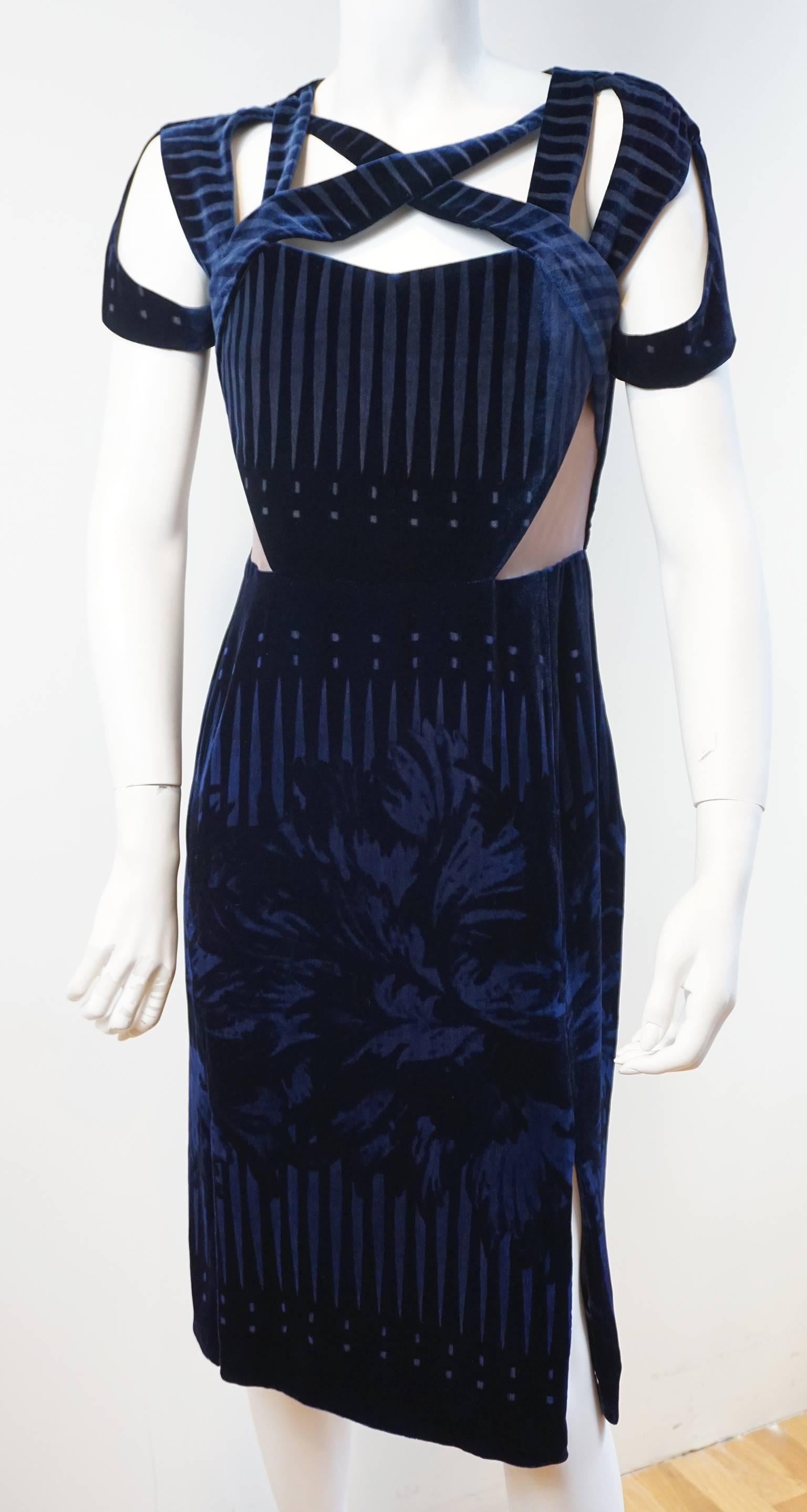 The rich navy velvet is decorates with a tonal floral and gprahic print that further accentuates the silhouette. There is an internal zipper corset. This secures the bodice and allows the straps to rest across the top of the chest. There are lined,