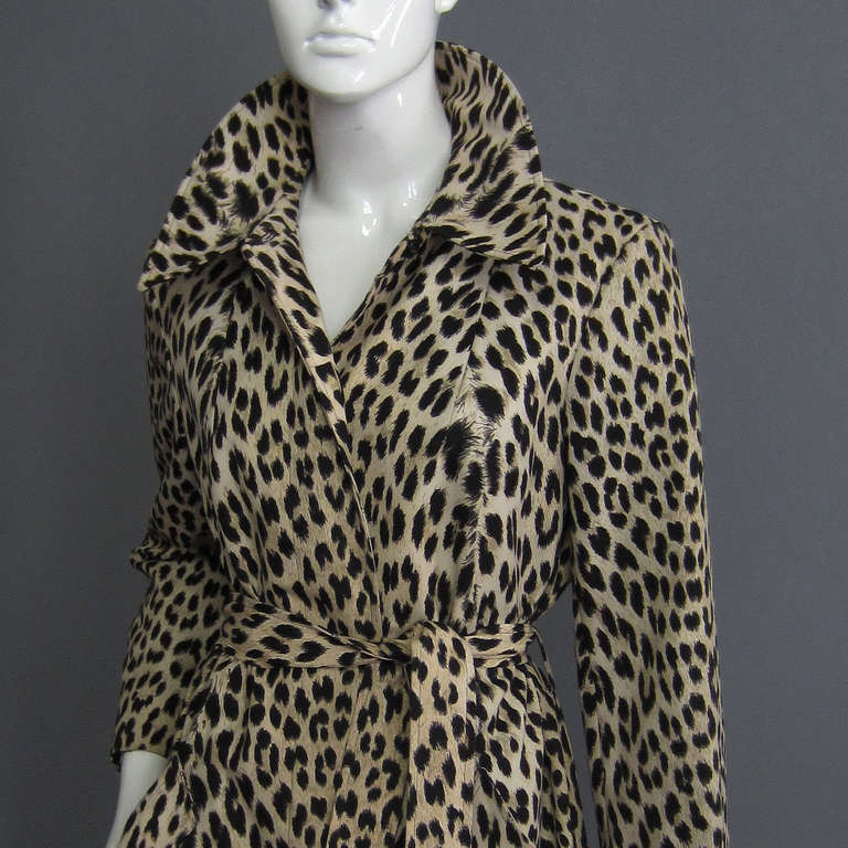 Make a statement in this leopard print coat. The lightweight, printed cotton canvas is ideal for spring, but can be worn into fall. The front features hidden button closures. Side pocket details are accented with a 1