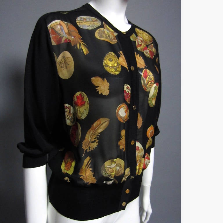 HERMES cardigan style top, this piece is as versatile as it is beautiful. The backside and the sleeves are made of a tight, black knit. There is a 2