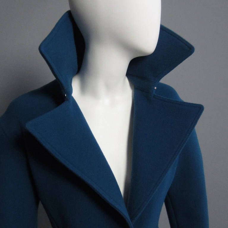 This coat is a testament to the design genius of the one and only ALBER ELBAZ. This Lanvin coat is from the 2012 collection that celebrated ALBER ELBAZ's 10 year anniversary as the head designer of the house of LANVIN. The gorgeous teal wool is a