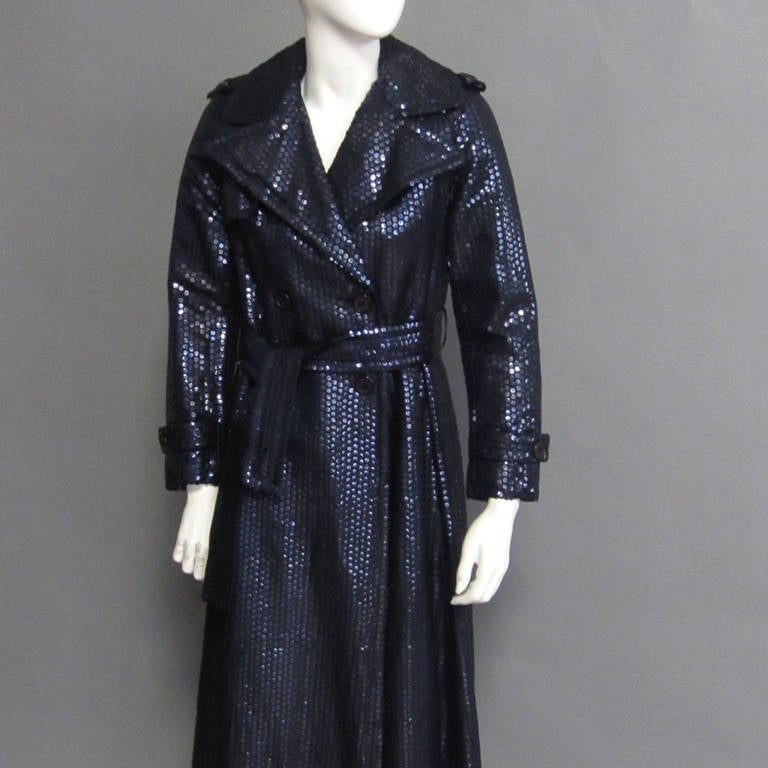 All a woman needs to make an outfit stand out is a fabulous coat. This BILL BLASS coat is the epitome of fabulous! The navy sequins create a gorgeous sheen and color that brightens every skin tone. BILL BLASS balances the sequins with the classic
