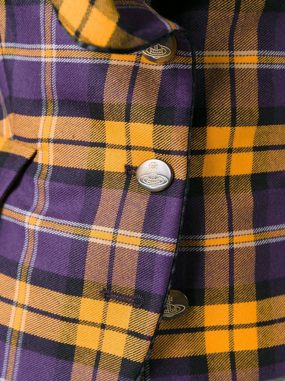 1990s Red Label Purple and yellow wool check jacket from Vivienne Westwood Vintage featuring a shawl collar, long sleeves, button cuffs, a front buckle fastening and front flap pockets.
Made in Italy.
size 42 IT.
Outer Composition
Wool 100%
Lining