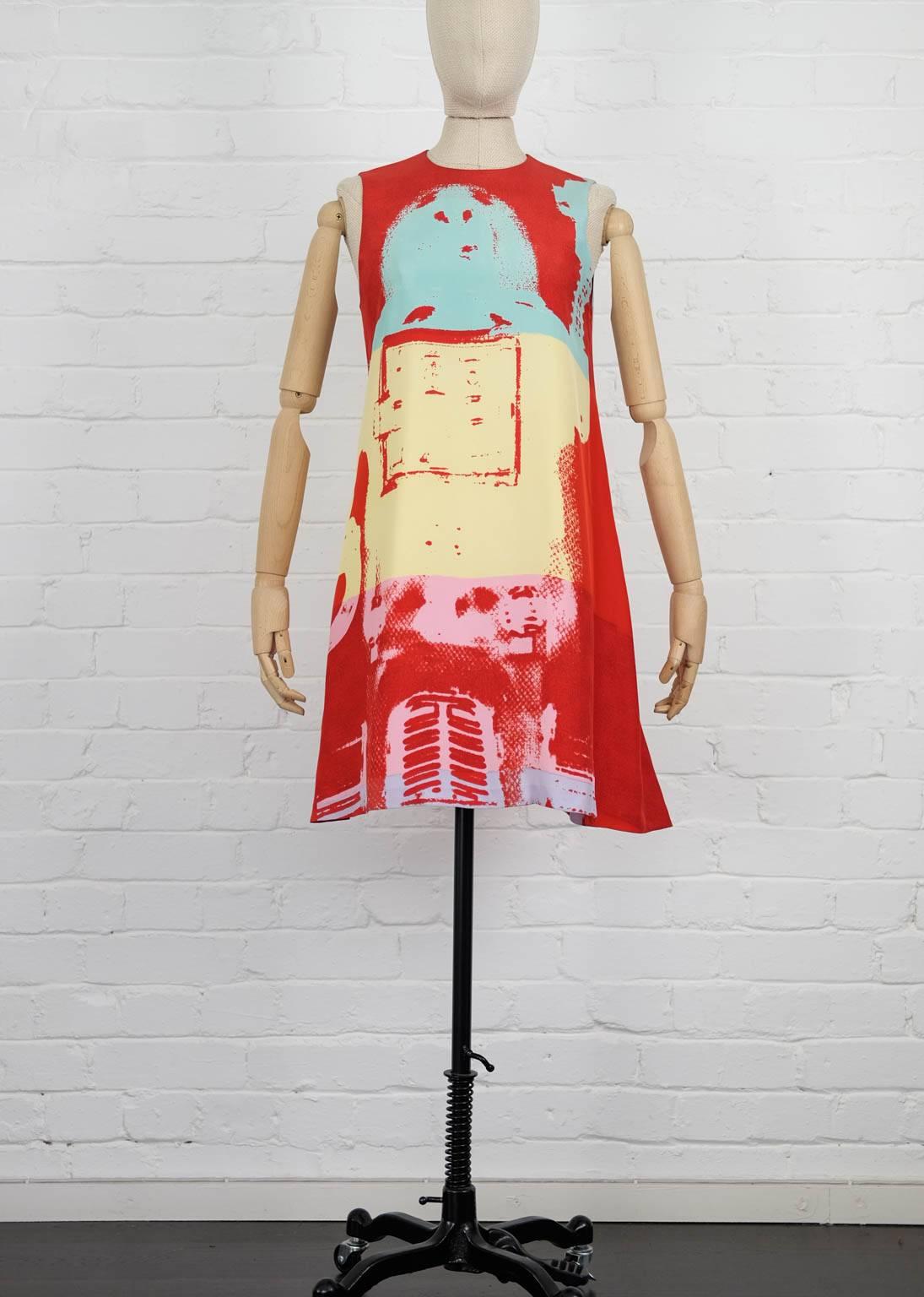 Multicoloured Andy Warhol silk graphic print dress from Stephen Sprouse Vintage featuring a round neck, a sleeveless design, a flared style, a rear keyhole detail, a back button fastening and a short length. The dress has a second lining dress also