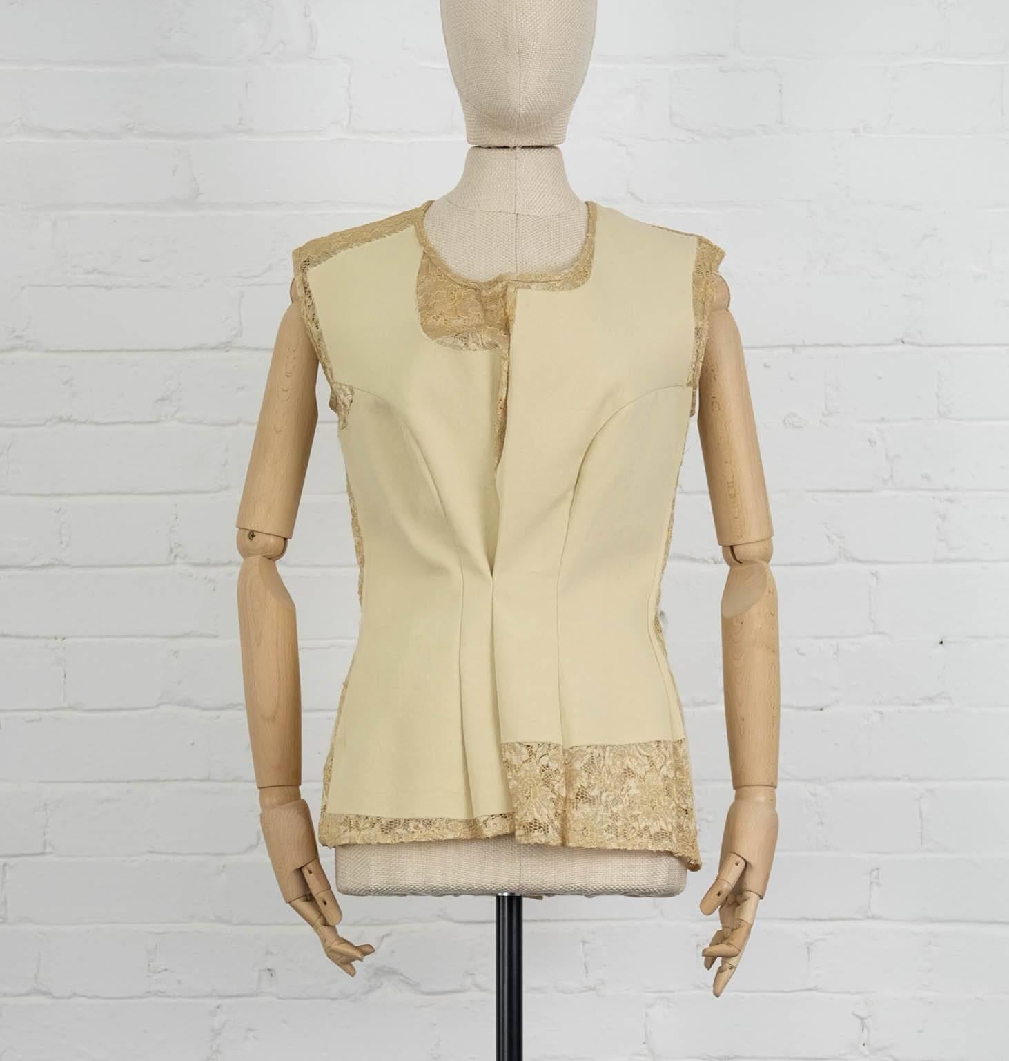 Nude and gold-tone wool lace insert top from Comme Des Garçons featuring a scoop neck, metallic threading, a sleeveless design, a fitted silhouette, pleated details and a straight hem. 

Fall 1997