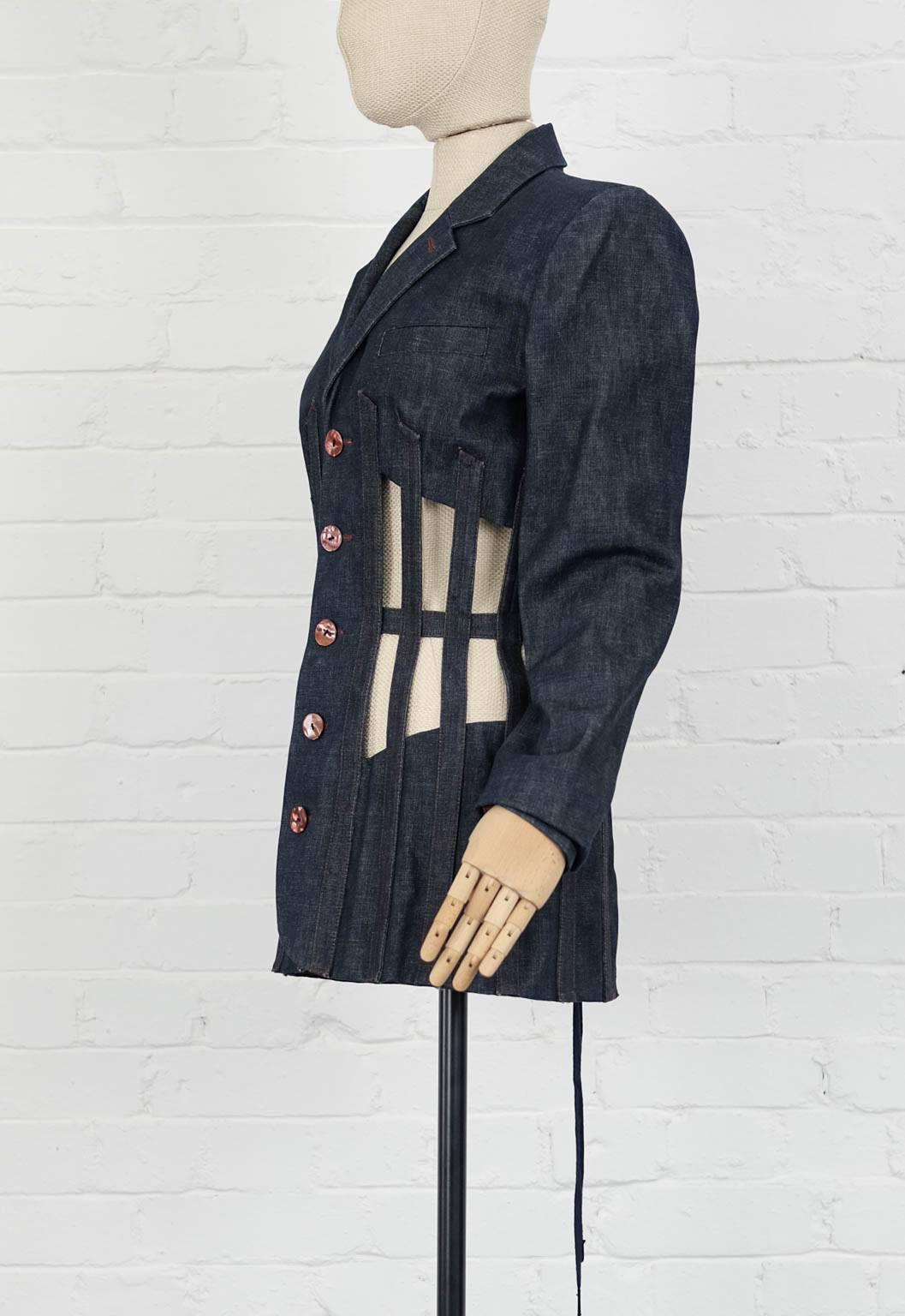 Blue silk and cotton denim cage jacket from Jean Paul Gaultier Vintage featuring notched lapels, a front button fastening, a chest pocket, long sleeves, button cuffs, a slim fit, a straight hem, a full lining, symmetrical cutaway boned panels to the