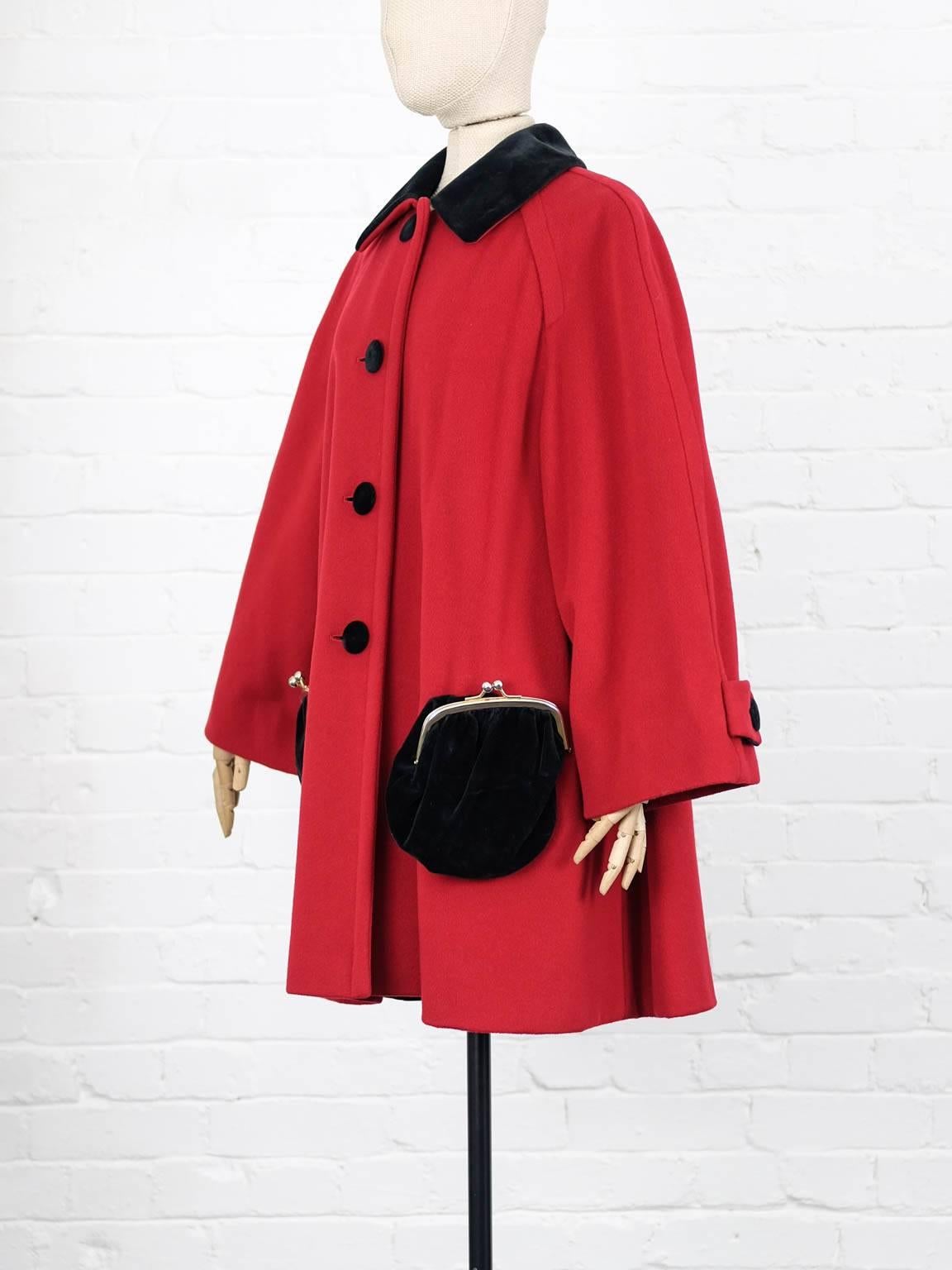 Red and black wool purse pocket coat from Moschino Vintage featuring a spread collar, a front button fastening, long sleeves, button cuffs, a loose fit, a seamed waist, a straight hem and purse style pockets to the front