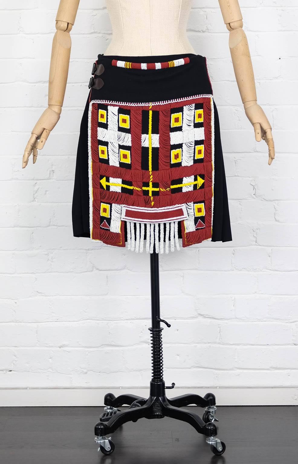 Multicoloured wool 1999 'Le 3e Millenaire Sera Amour' beaded skirt from Jean Paul Gaultier Vintage featuring an a-line shape and a side buckle strap fastening. 