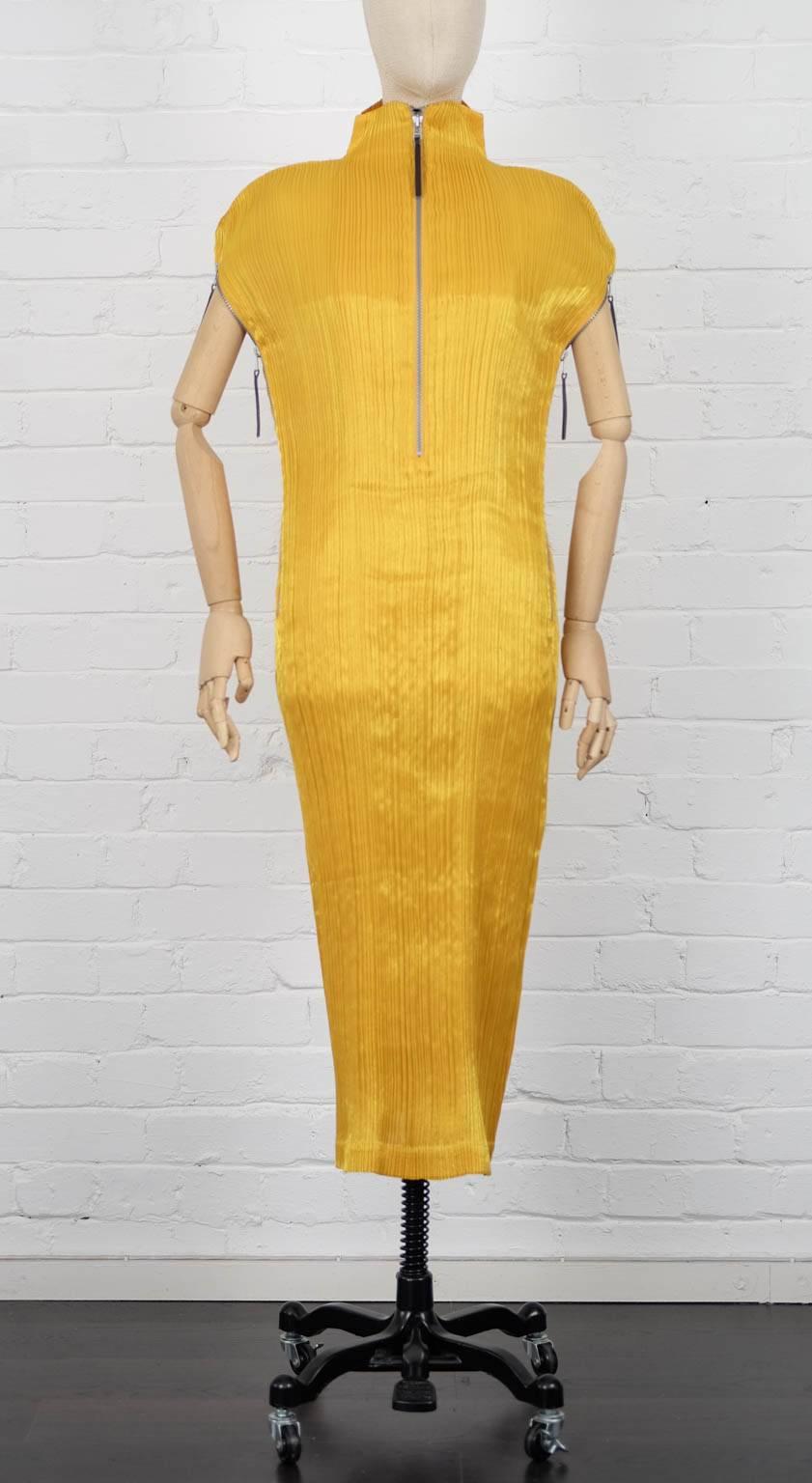 Yellow pleated dress from Issey Miyake Vintage featuring a high standing collar, short raglan sleeves, a rear zip fastening and a mid-length.