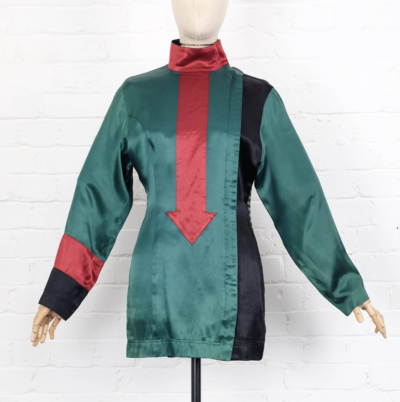 Green, black and burgundy cotton blend arrow appliqué long top from Jean Paul Gaultier Vintage featuring a funnel neck, a velcro fastening, a concealed zip fastening, long sleeves, contrasting panels and a straight hem. 

1986/87 Jean Paul Gaultier
