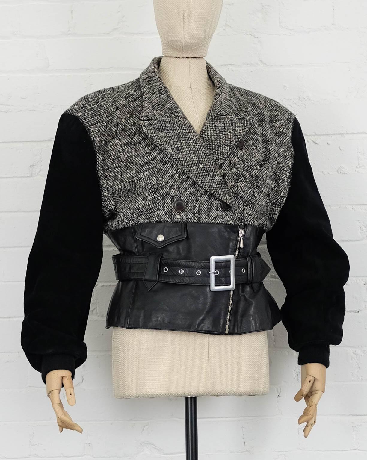 Black leather, suede and wool blend  biker jacket from Jean Paul Gaultier Vintage featuring notched lapels, a chest pocket, a double breasted front fastening, a belted waist, a front zip fastening, long sleeves, a grey tweed top and a press stud