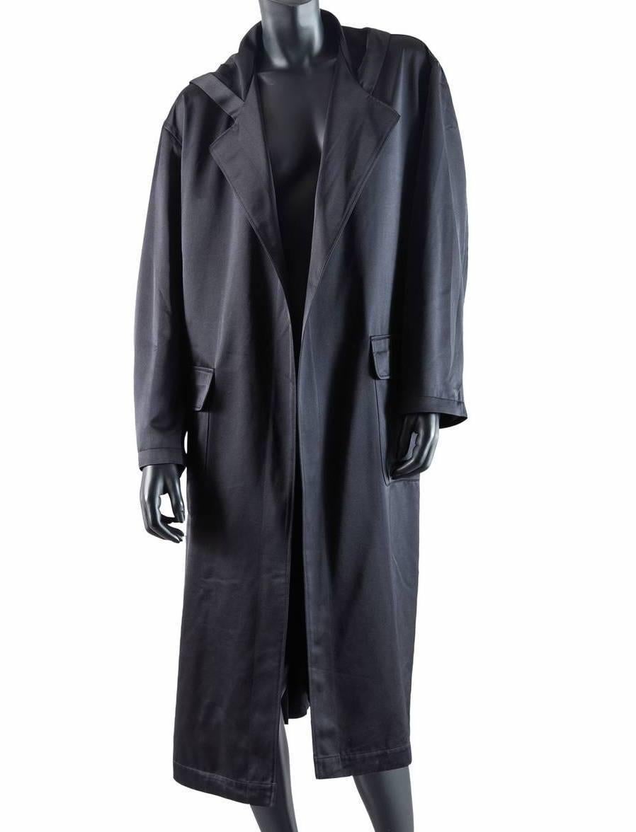 Rare Fall / Winter 1995 Runway Staff Uniform. These were made in limited quantities exclusively for the Yohji Yamamoto staff working backstage during the Fall / Winter 1995 Womenswear show in Paris.

Black 1995/96 hooded staff coat from Yohji