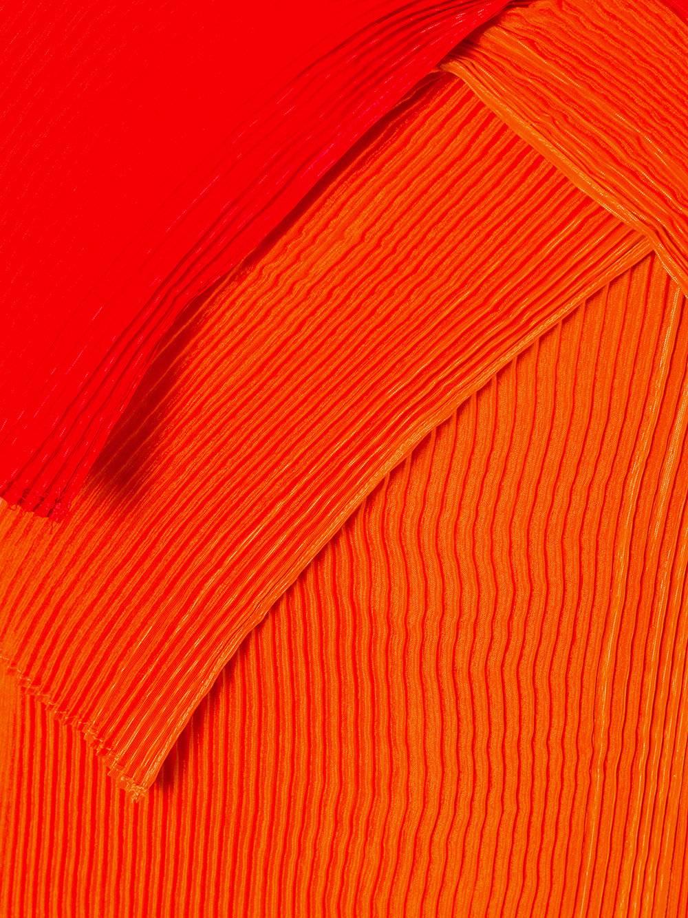 Orange and red asymmetric pleated dress from Issey Miyake Vintage featuring an off the shoulder design, spaghetti straps, long sleeves, a layered design, pleated details and a pull-on style.  Excellent condition.
size M
Outer Composition:
polyester