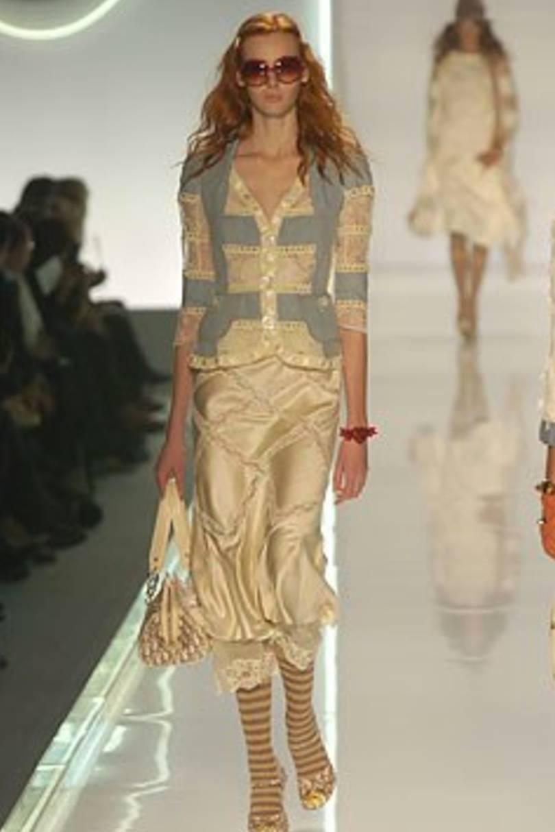 2005 Christian Dior by John Galliano.
. This denim and white cotton lace and crochet insert jacket from Christian Dior features notched lapels, a button fastening, a fitted silhouette, long sleeves, lace panels and crochet insets.
Size FR 38