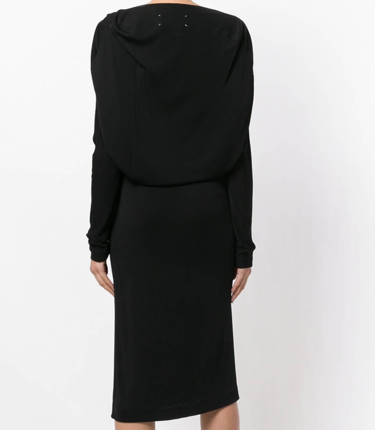 Black raw seam dress from Maison Martin Margiela featuring a boat neck, long sleeves, an over-the-knee length and a draped back. size 42 IT .
Made in Italy,
Composition
Viscose 100%
Washing Instructions:
Dry Clean Only