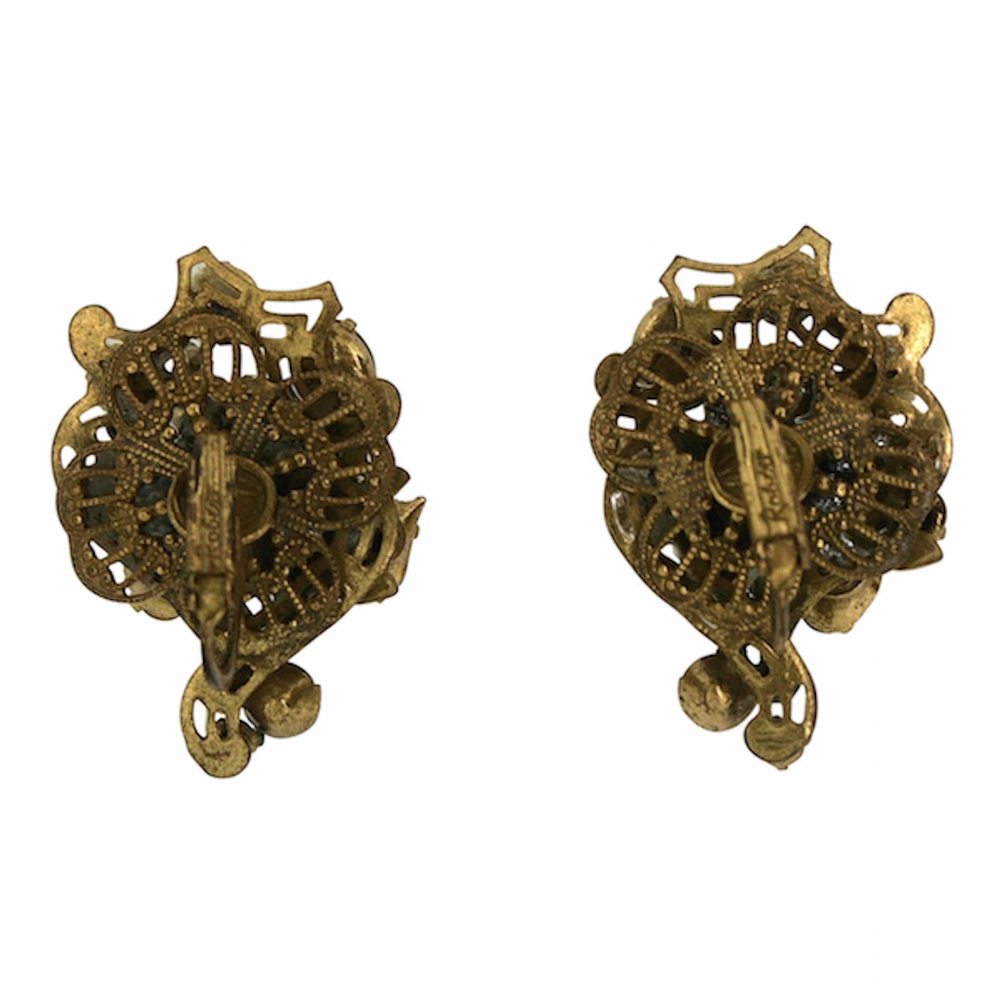 A beautiful example of mid-century design, these earrings date from the late 1950s and were created in the USA by Robert. 

Condition Report:
Excellent

The Details...
These gilt metal earrings feature a filigree floral design set with teardrop,