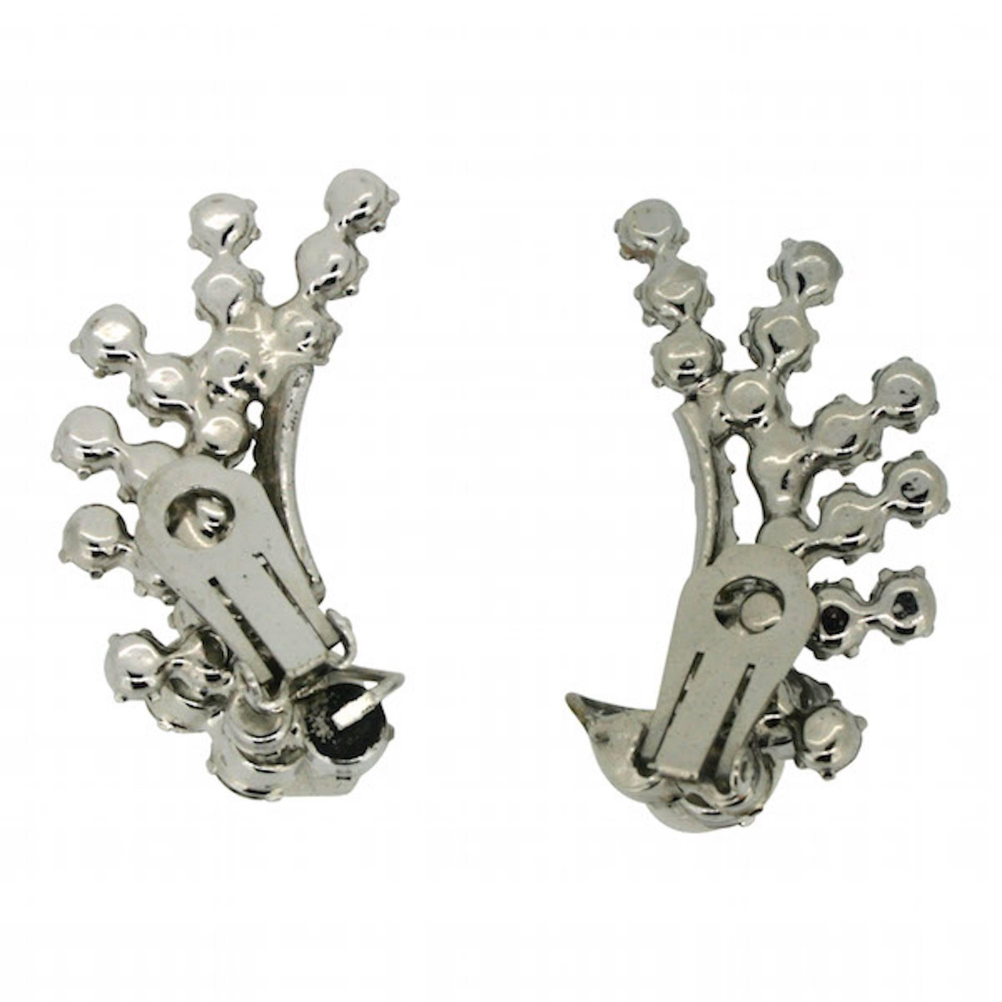 These earrings are dramatic and beautifully crafted. They are from the Delizza and Elster company's 'Juliana' line and can be dated to either 1967 or 1968.

Condition Report:
Excellent

The Details...
These earrings are silver tone and clip on. They