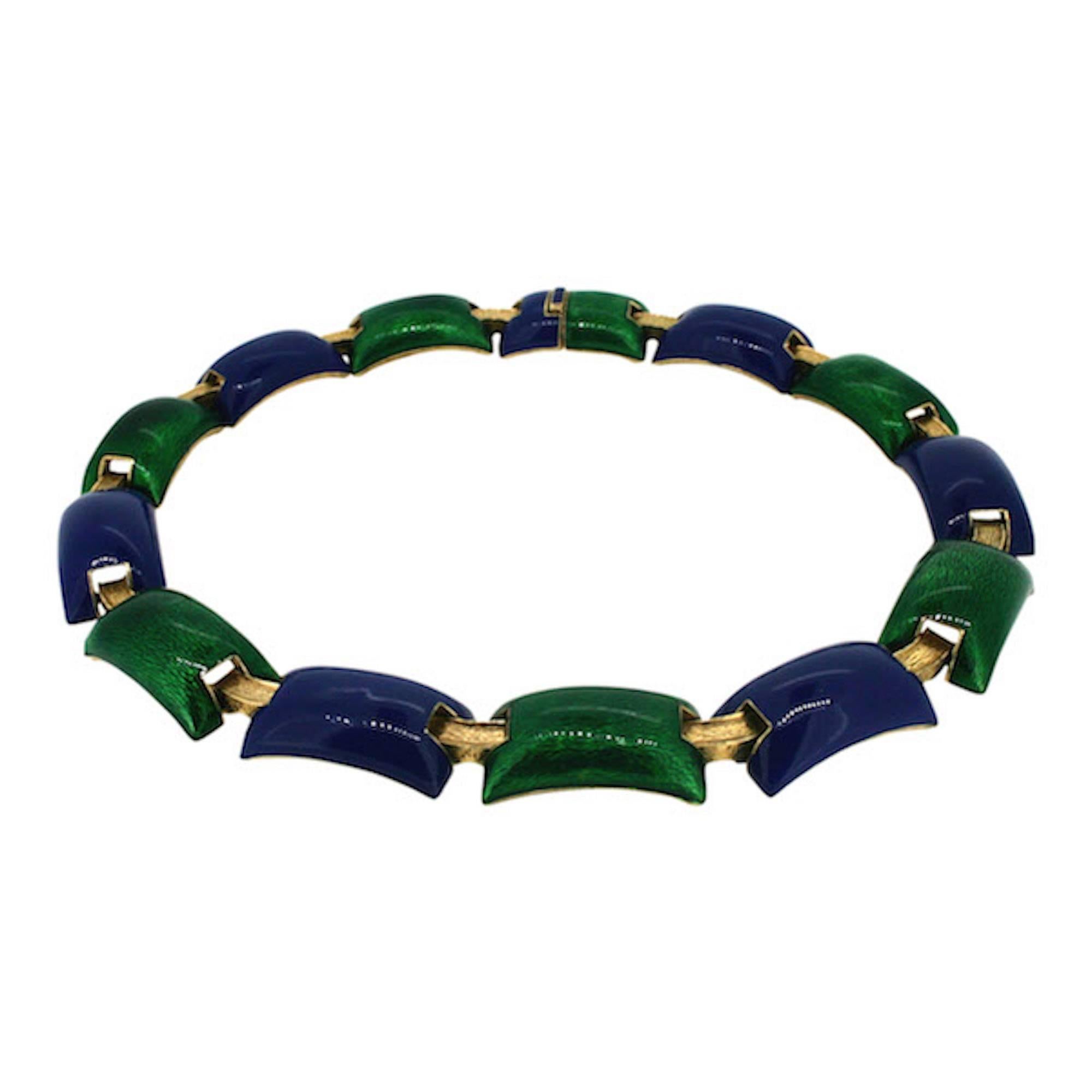Featuring beautiful enamel work in jewel tones, this necklace dates from the 1970s and was made by Ciner.

Condition Report:
Good - The enamel work on one of the green panels must have been chipped off and reglued at some point in this necklaces'