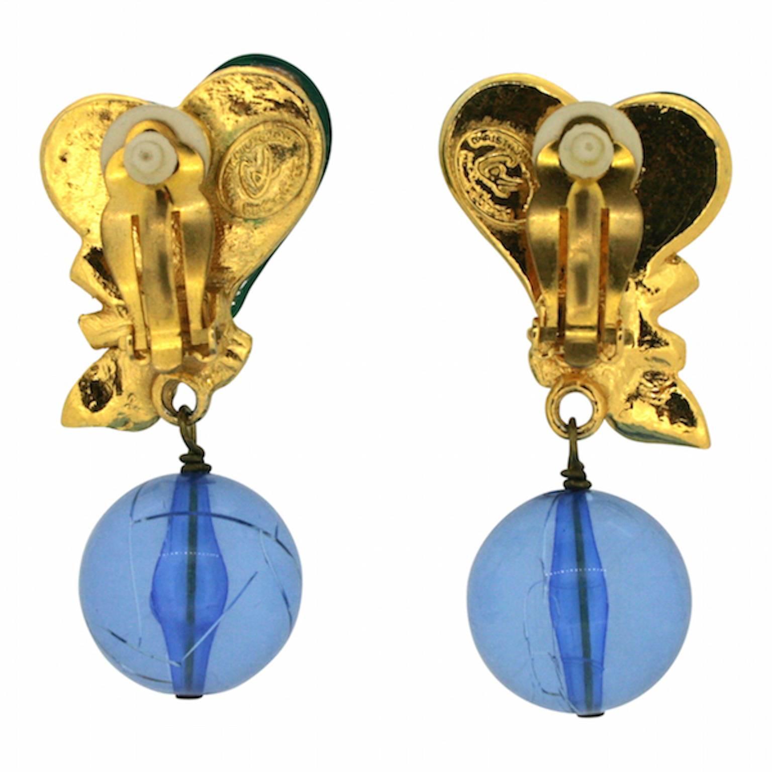 Glamorous and colourful, these show-stopping earrings by French designer Christian Lacroix were made in the 1990s. They are clip on. 

Condition Report:
Good - Some minor scratching to the surface of the blue perspex ball consistent with age and
