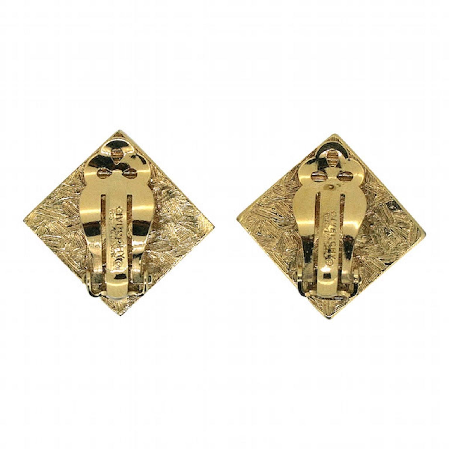 Beautifully crafted and colourful, these earrings by Givenchy. They date from the 1980s and are clip on.
Condition Report:
Excellent

The Details...
These gold tone square shaped earrings are set with square cut rhinestones of various shades of