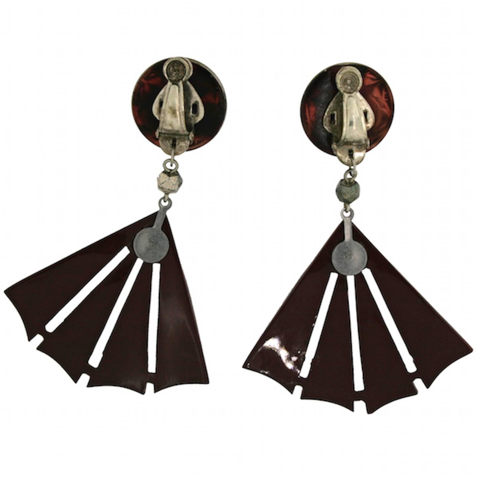 These celluloid earrings date from the 1920s. They are clip on and by the legendary French manufacturer Auguste Bonaz.
Condition Report:
Very Good - Some wear to the metal reverse and the plastic surface consistent with age and use. This is only