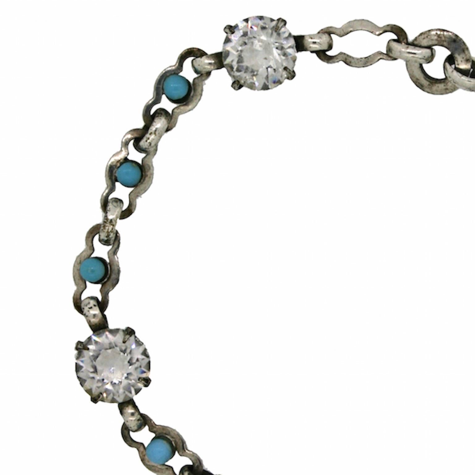 Shimmering and delicate, this bracelet dates from the 1920s and is unsigned. It features a pretty design, which can be enjoyed for centuries to come. 
Condition Report:
Very Good - Minor wear to the silver tone metal. This is consistent with age and