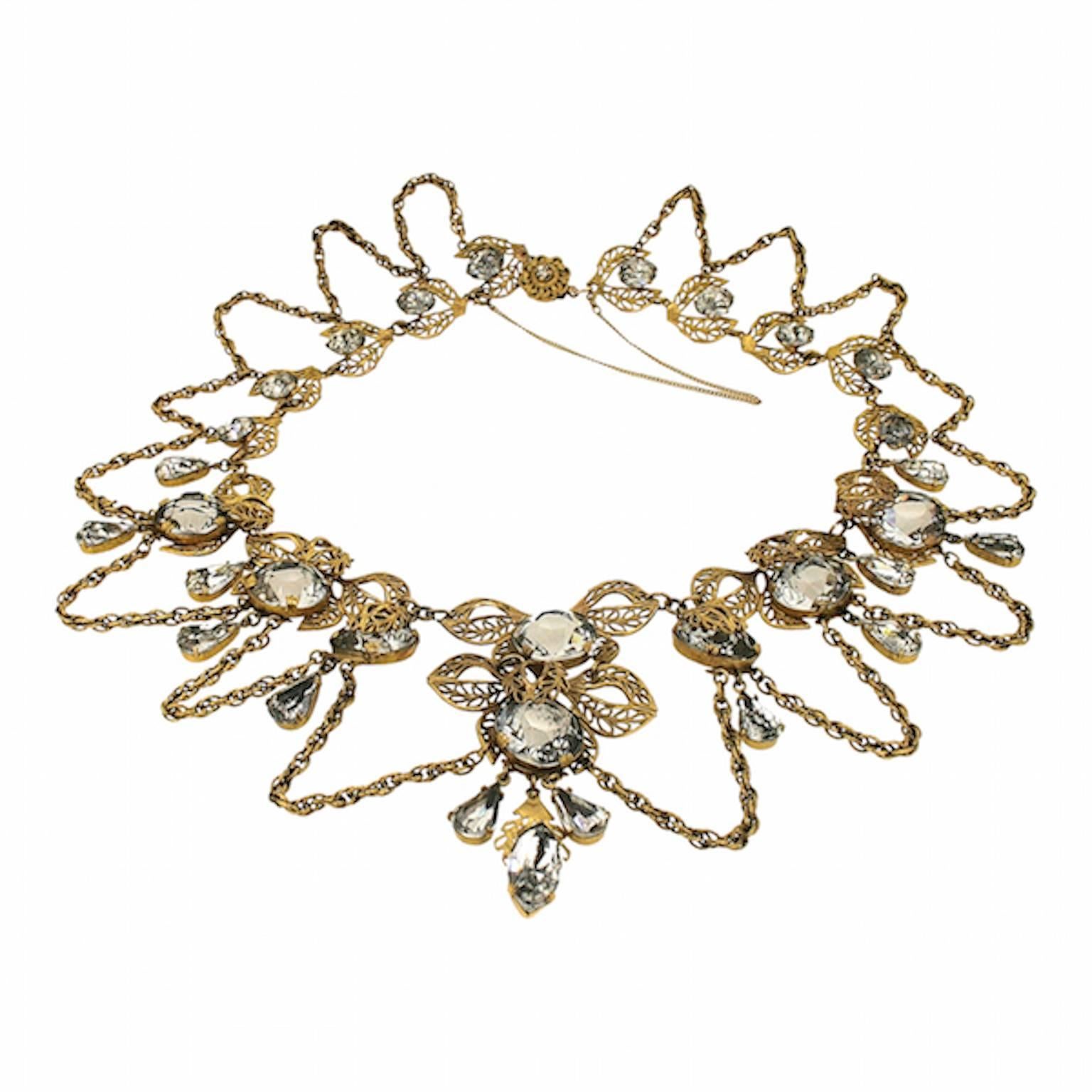 A beautifully designed and quality constructed 1950s necklace. This piece is most likely to have been manufactured in France for a couture house. 
Condition Report:
Good - Wear to the foil back reverse of the larger rhinestones and an error when