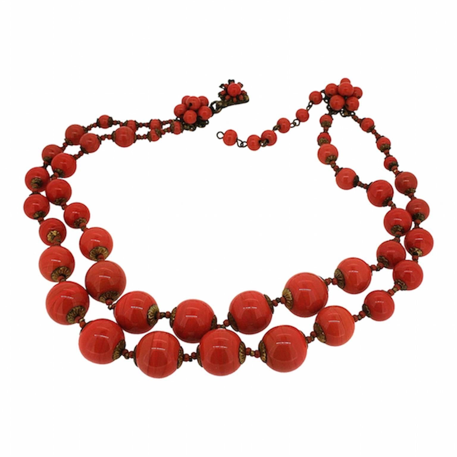 A lovely example of the Miriam Haskell company's beadwork and style, this necklace dates from the 1960s. 
Condition Report:
Excellent
The Details...
This necklace features two strands of coral coloured glass beads and rondelles of varying sizes.